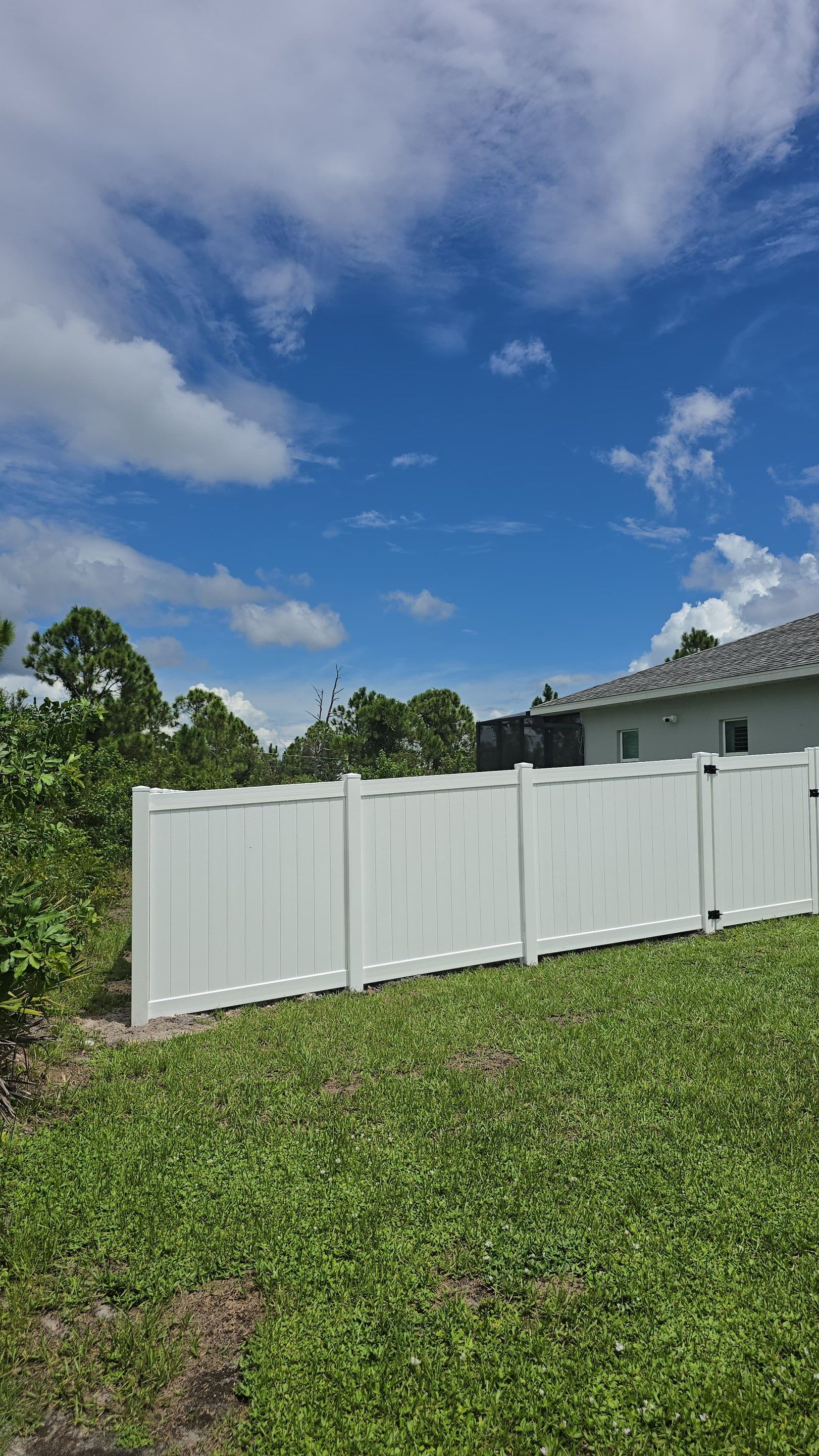 White Vinyl Privacy Fence Installation in Port Charlotte Florida by True Fence LLC