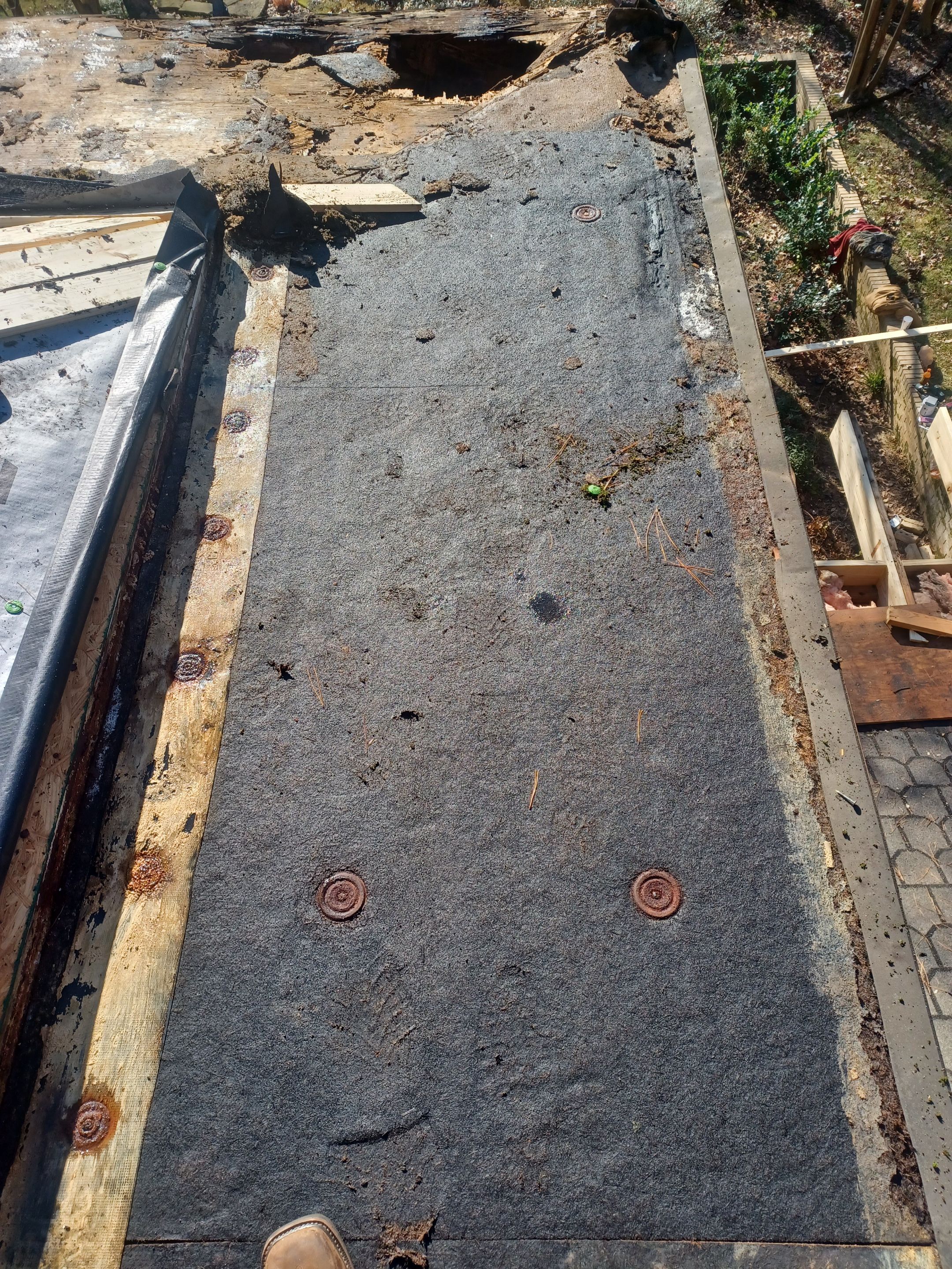 Residential Roofing Installation using PVC membrane and 24 gauge Standing Seam Metal by Hostetler Roofing