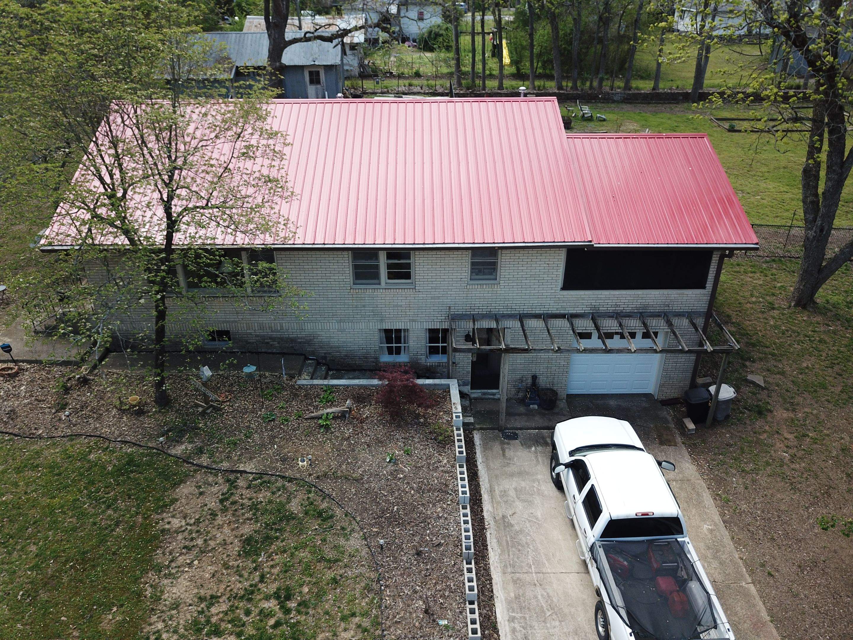 Residential Roofing Installation using 26 Gauge Colored Panels by Hostetler Roofing