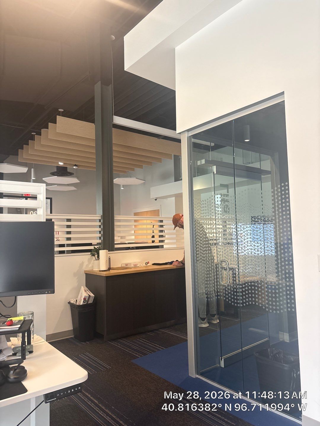 Modern Office Remodel with Acoustic Baffles and Glass Partitions by CompanyCam Sales Demo