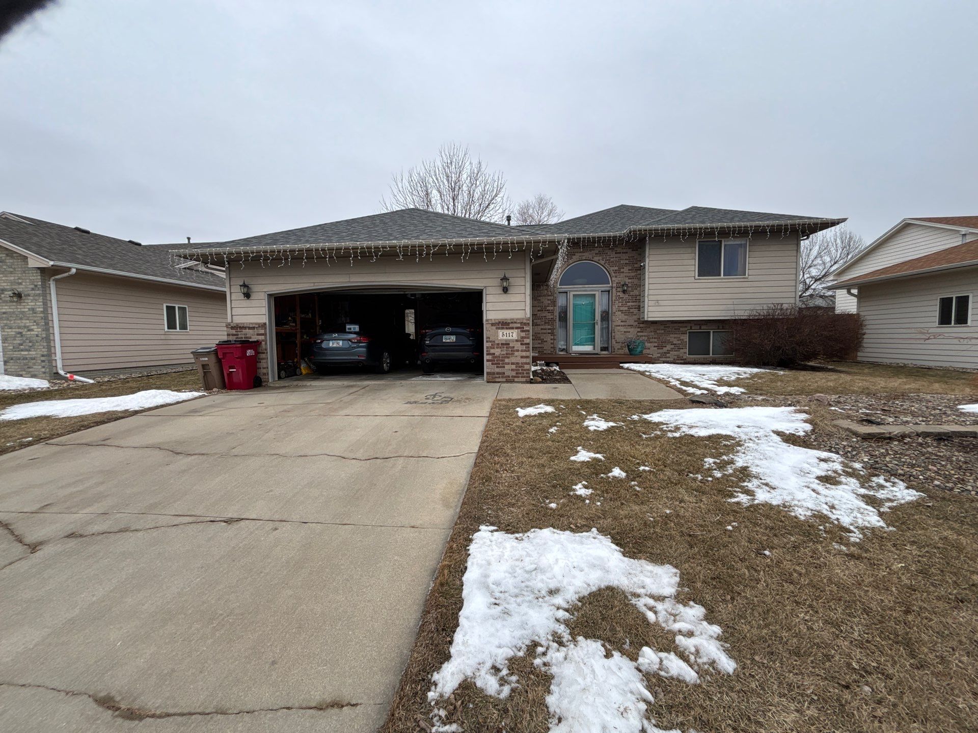 Exterior Painting and Wood Trim Replacement in Sioux Falls by Select Painting, Coatings & Garage Cabinets