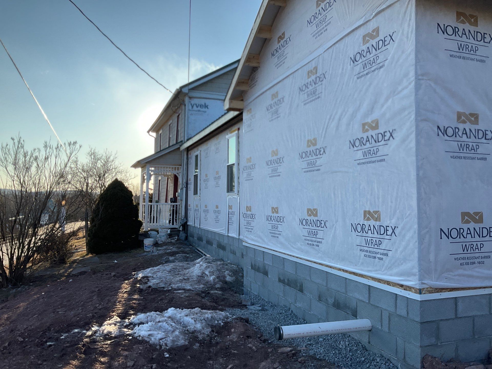 Multi-Story Residential Addition Featuring Textured Metal Siding in Millersburg by Esh Builders