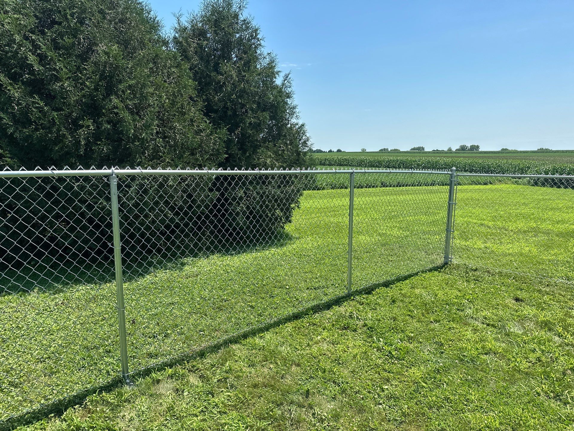 Residential Galvanized Chain Link Perimeter Fence Installation in New Hartford by Perfect Picket Fence and Stain