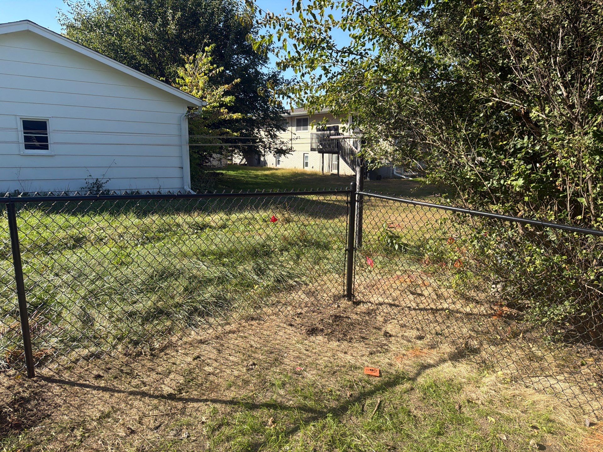 Black Chain Link Fence Installation with Double Gate in Cedar Falls by Perfect Picket Fence and Stain