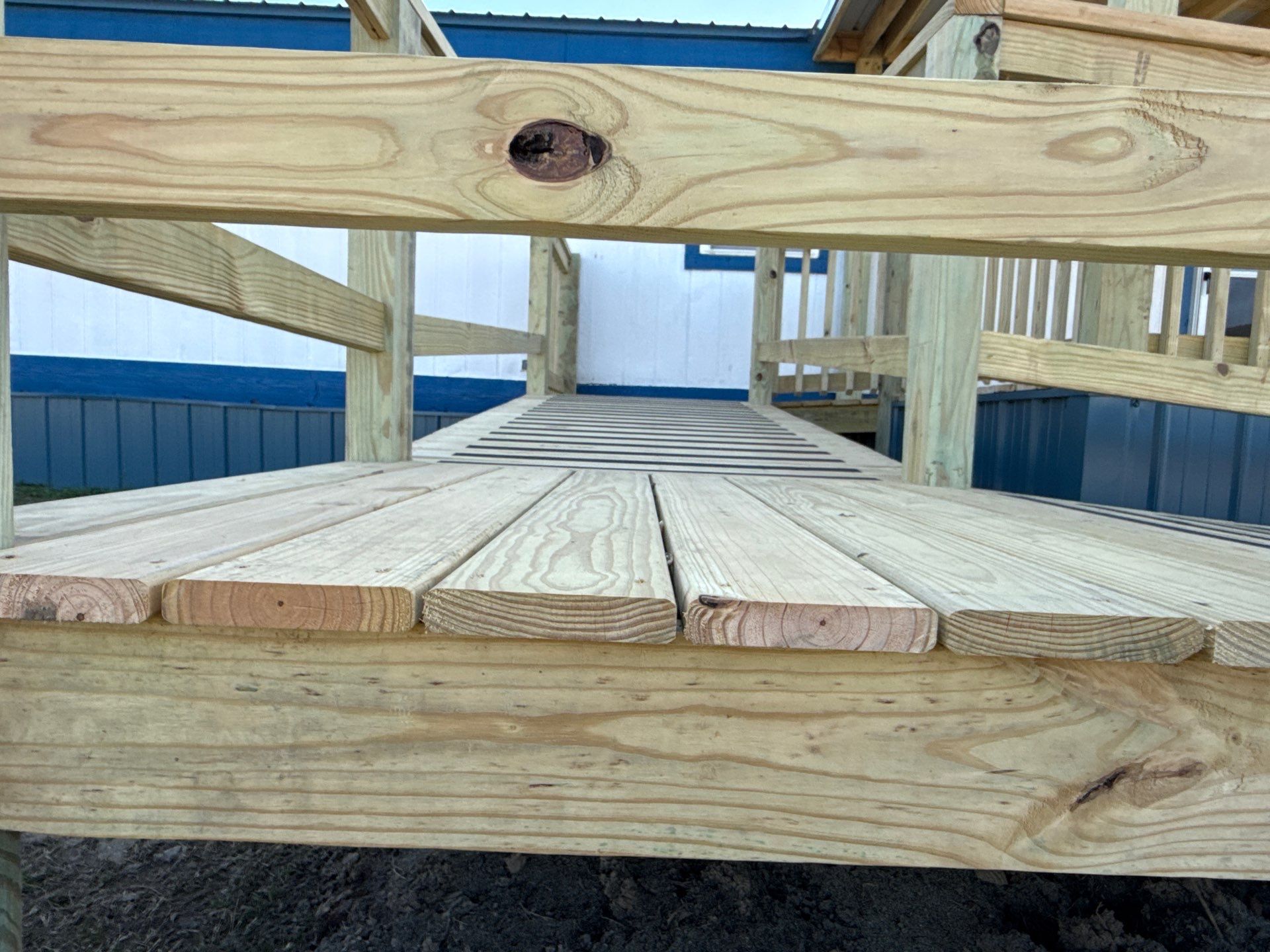 Covered Deck w/ ADA Ramp by In & Out Construction & Remodeling, LLC