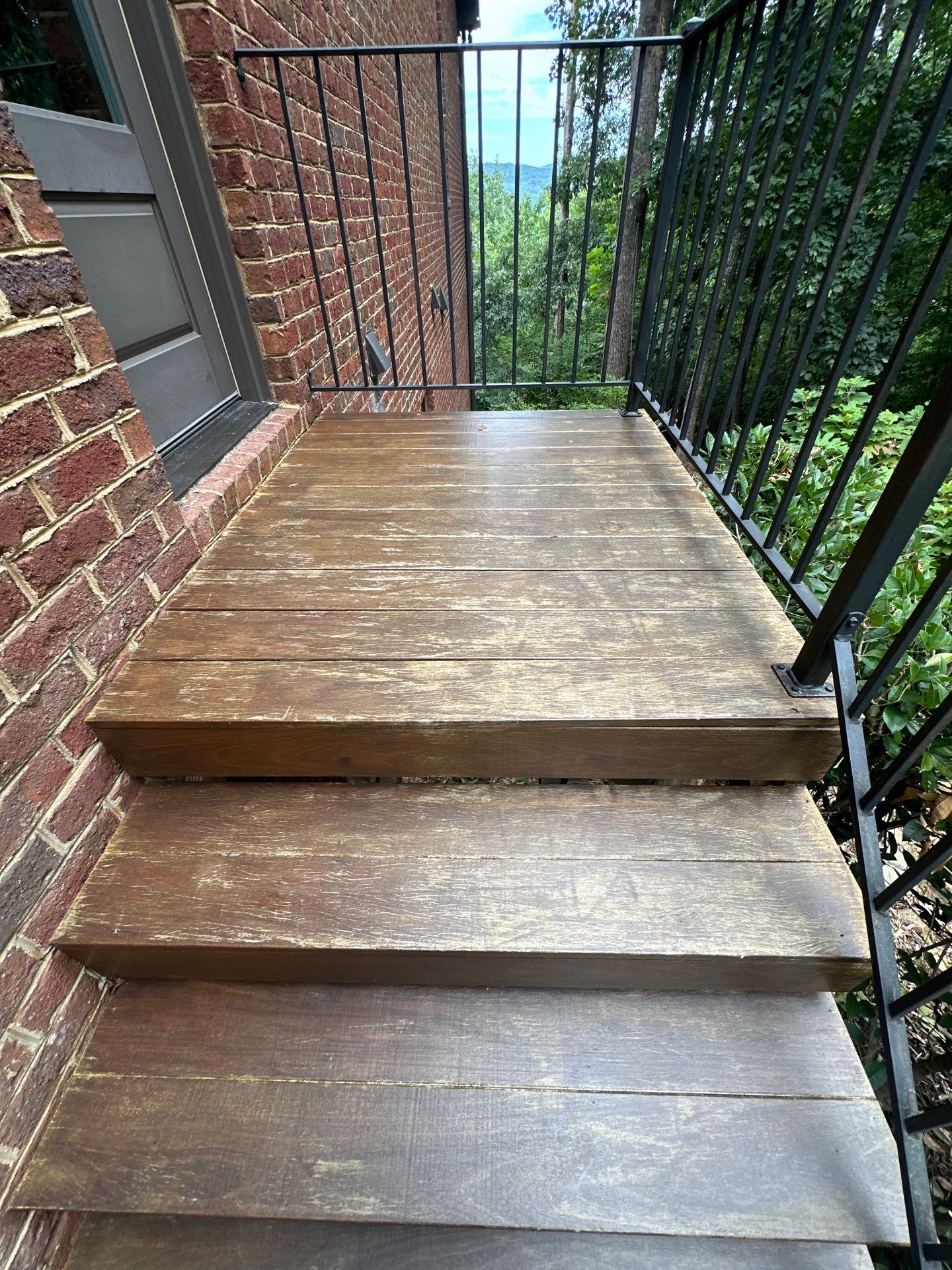 Wood Deck Refinishing and Black Metal Railing Upgrade in Travelers Rest by Painter1