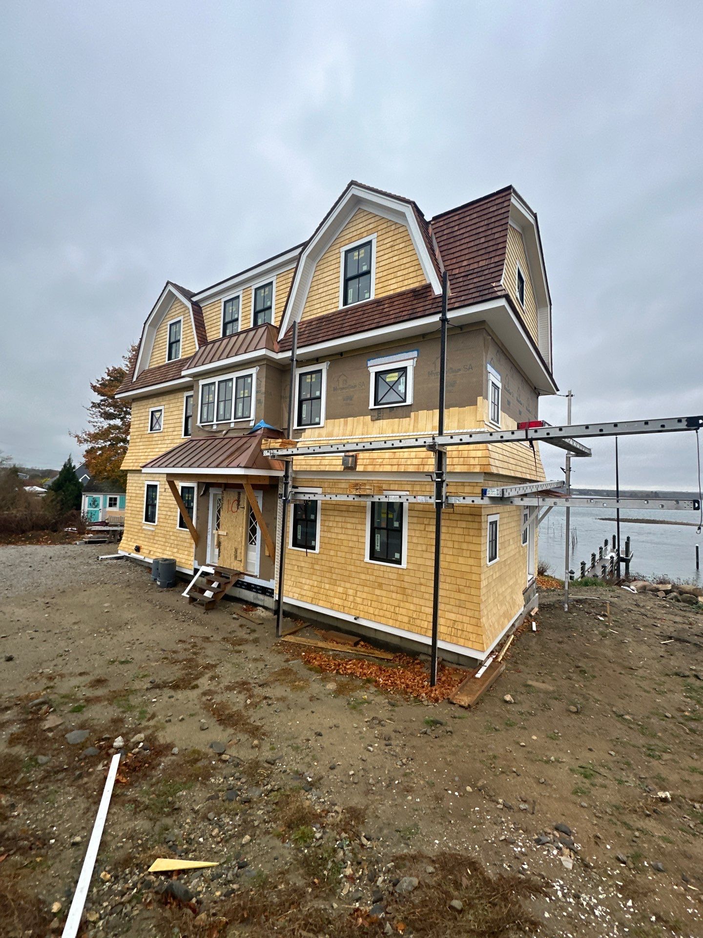 Great Island - Red Cedar Roofing, Yellow Cedar Siding, Standing Seam Copper, & Copper Gutters  by Rinaldi Brothers