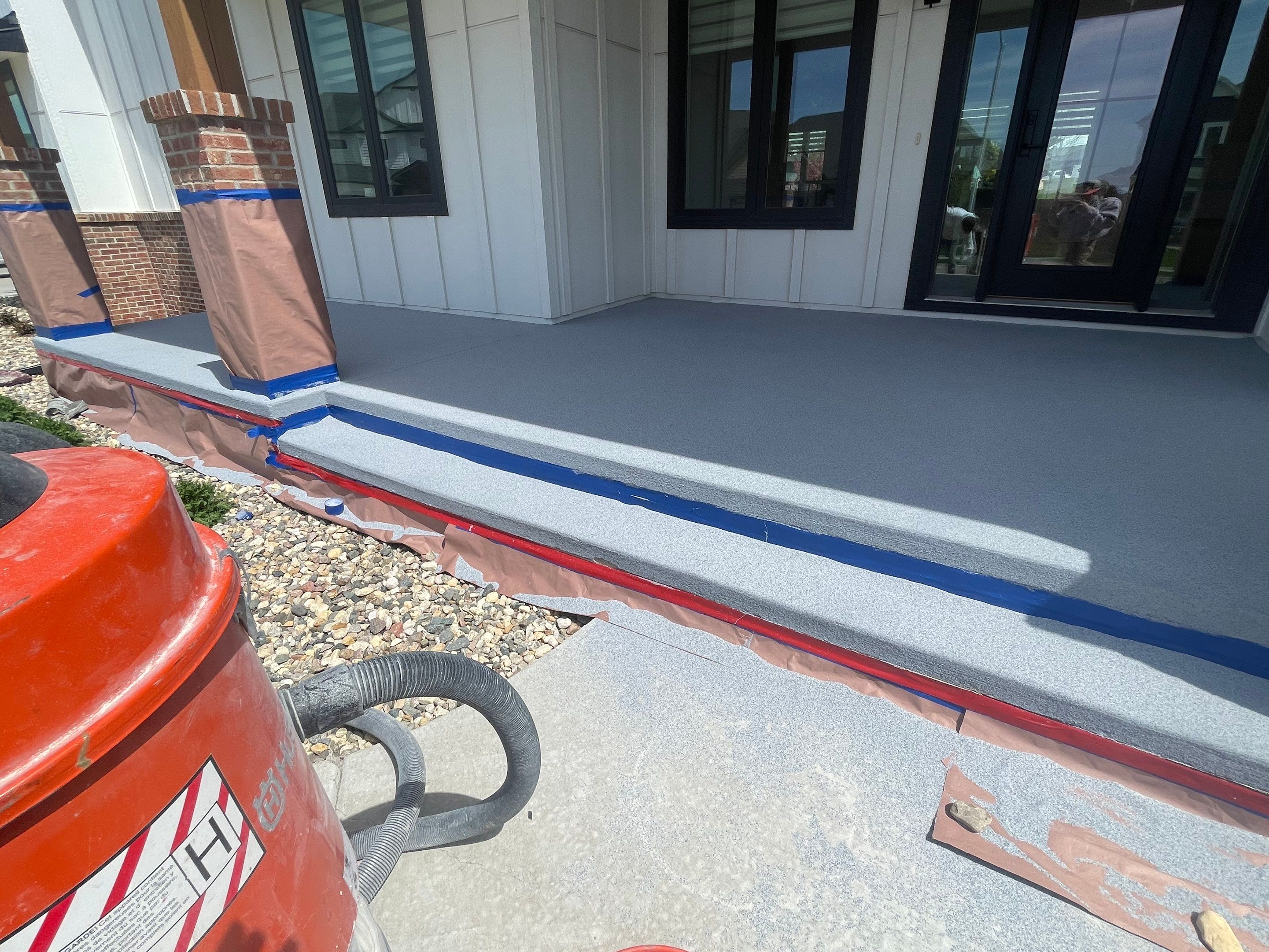 Grey Speckled Concrete Porch Coating for Sioux Falls Home by Select Painting, Coatings & Garage Cabinets
