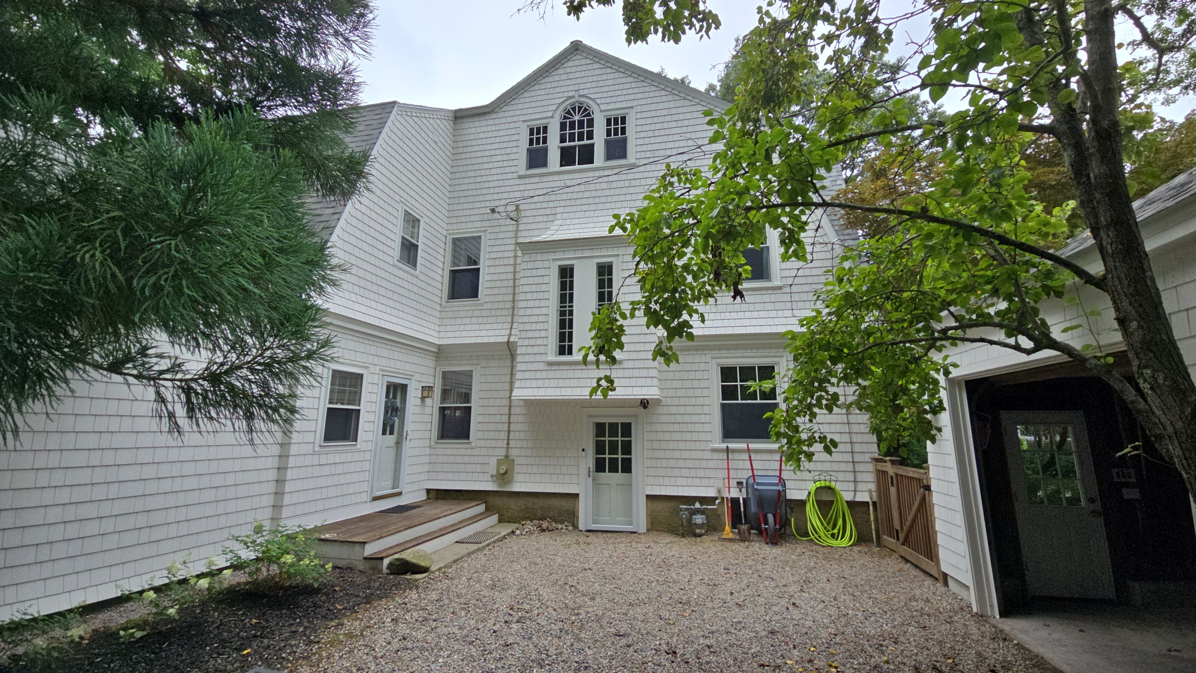 White cedar shingles and windows in Wayland, MA by UBrothers Construction