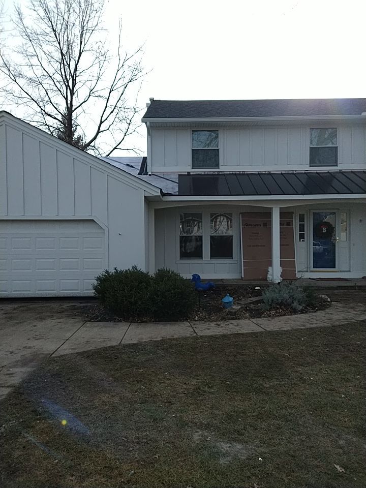 James Hardie Siding  using James Hardie Board and Batten, White by Absolute Roofing and Construction