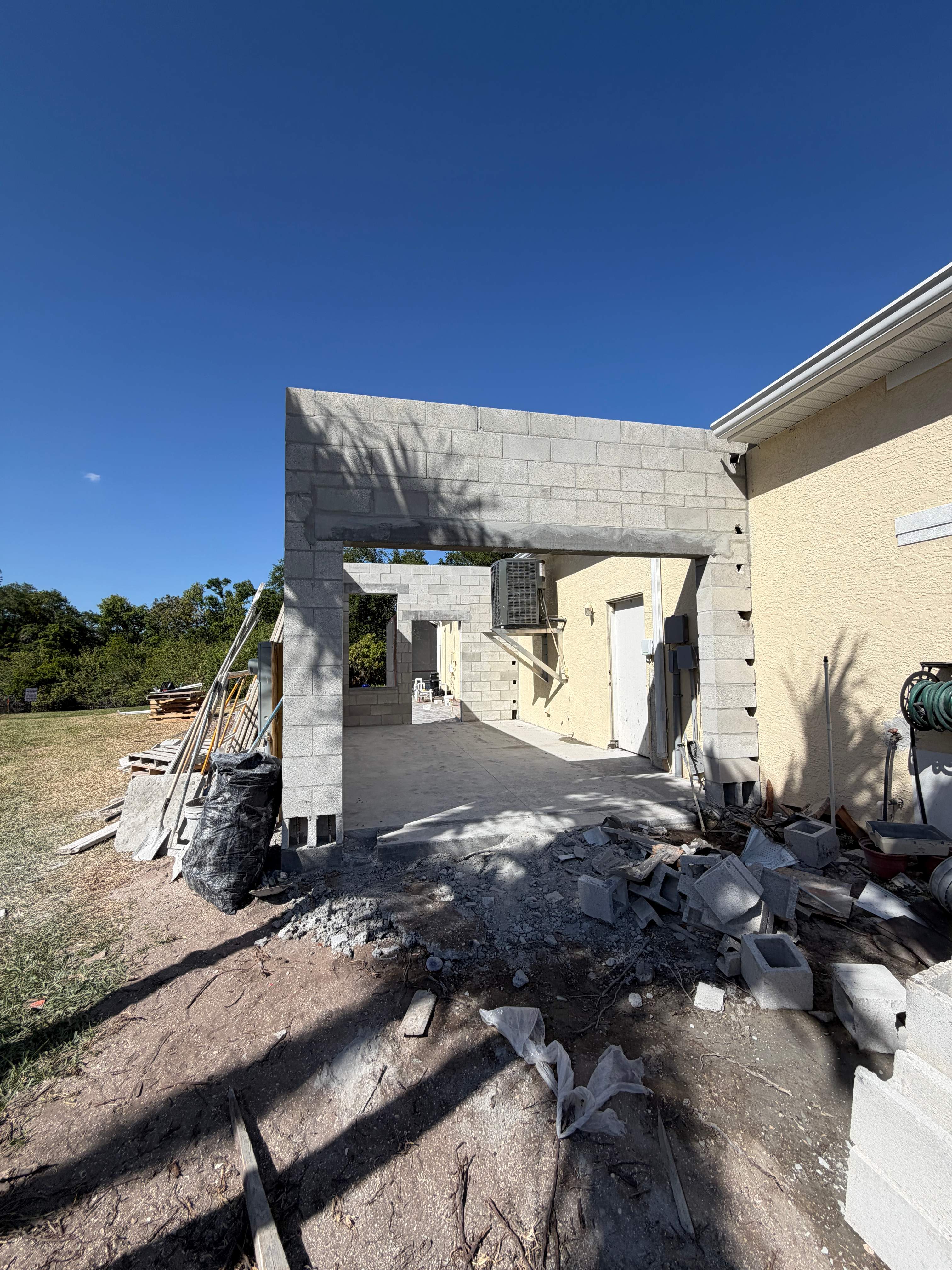 Custom Single-Car Garage Addition and Lanai Cage in Bradenton by Vertical General Contracting 