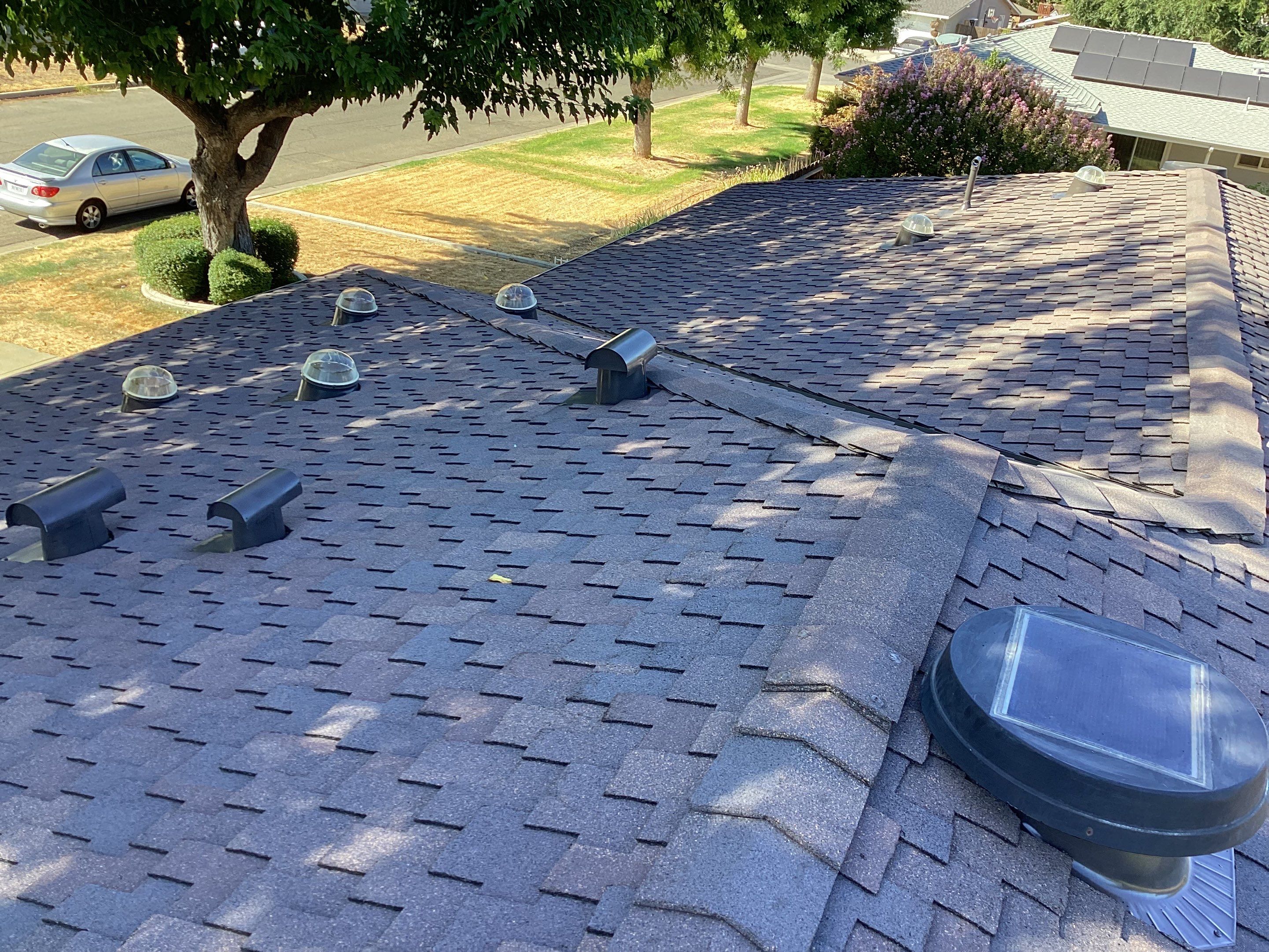 Installation of Certainteed Presidential shingles on residential house by Straight Edge Roofing Inc