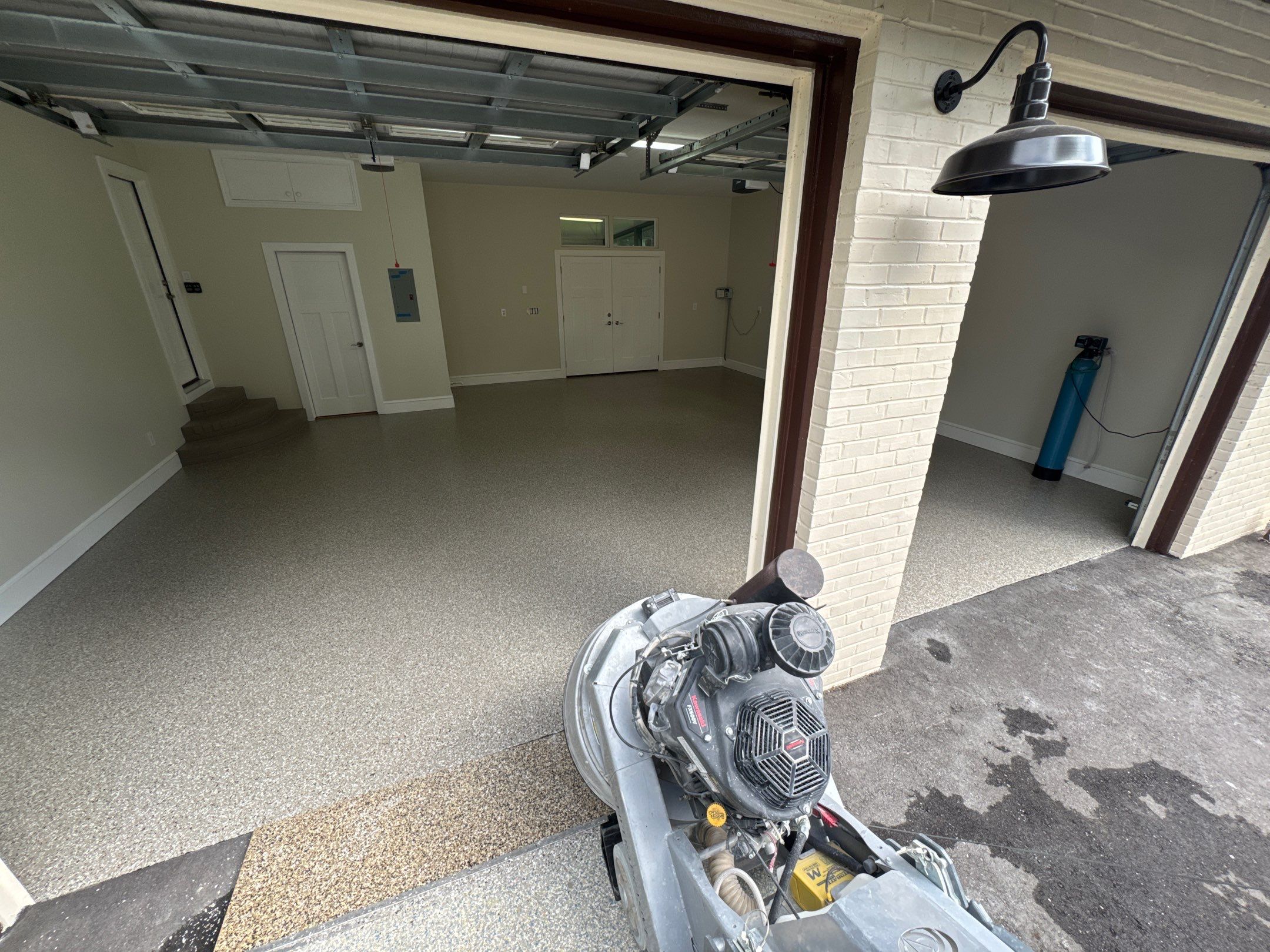 Garage and Sidewalk Project in Keystone Heights, FL in Pebble Beach by Cross Creek Concrete Coatings