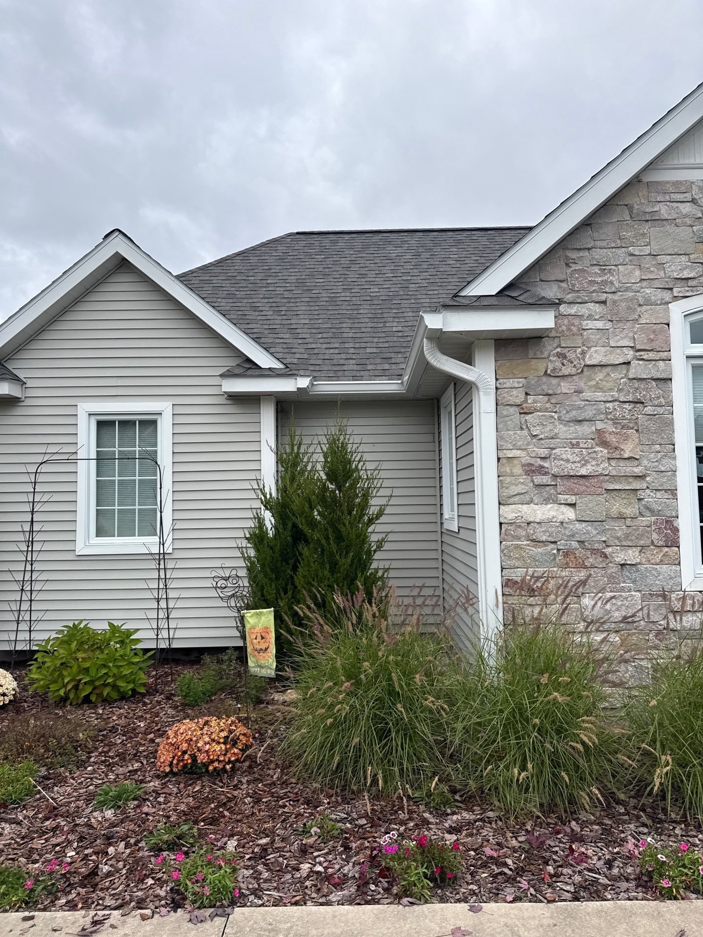 White Gutter System Installation for Traverse City Home by Rainbow Seamless Systems