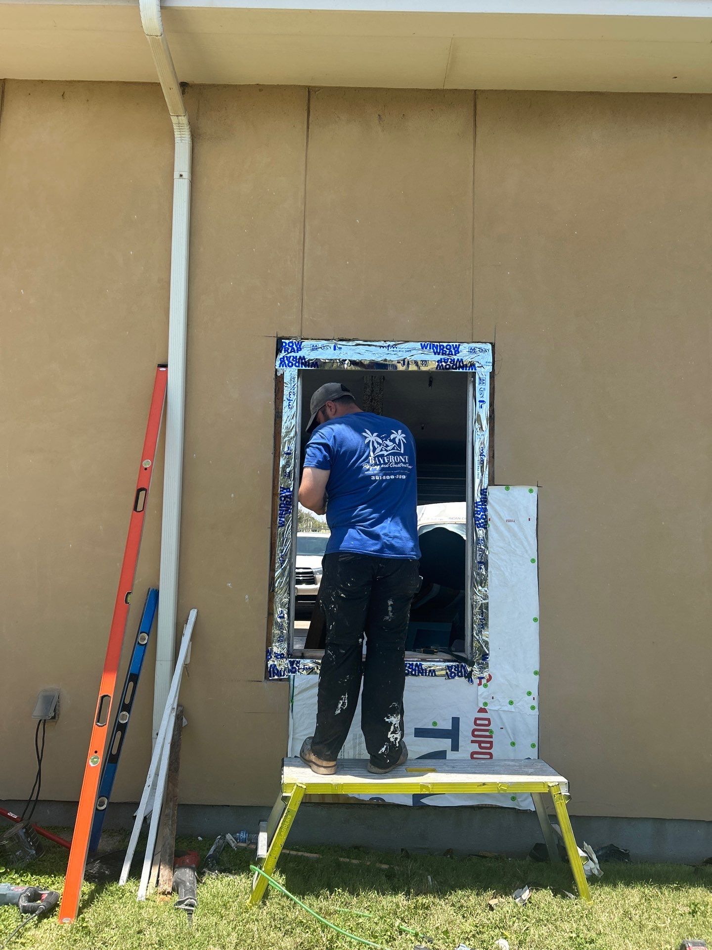 Installing Windows on a Submarine  by Bayfront Roofing and Construction