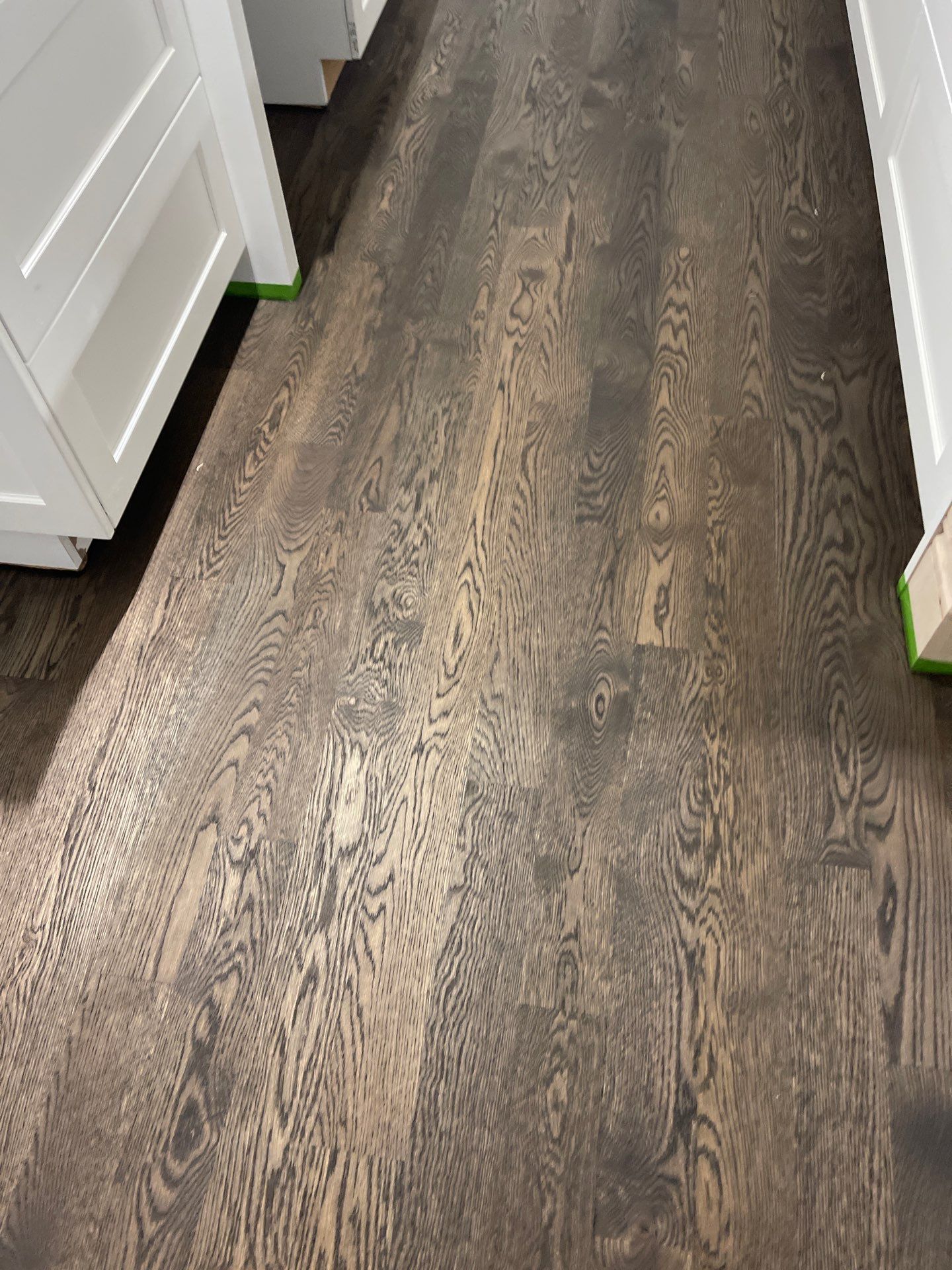 New Flooring installation using 4" White oak select grade plain sawn Ebony Stain by Ann Arbor Hardwoods