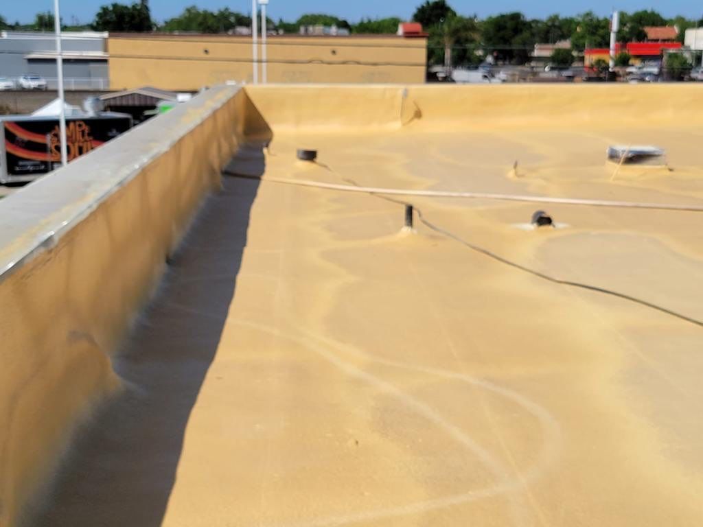 Spray foam and coatings using Conklin Benchmark/PUMA XL coatings and spray foam by Straight Edge Roofing Inc