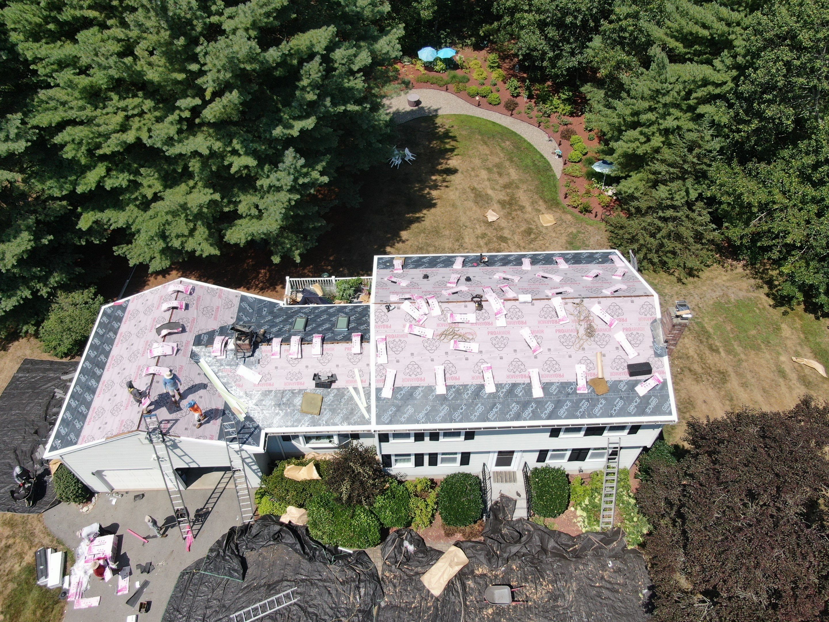 Complete Roof Replacement with Chimney Flashing, Gutter Guard System, and Vinyl Siding Repairs by Mighty Dog Roofing of Greater Middlesex County