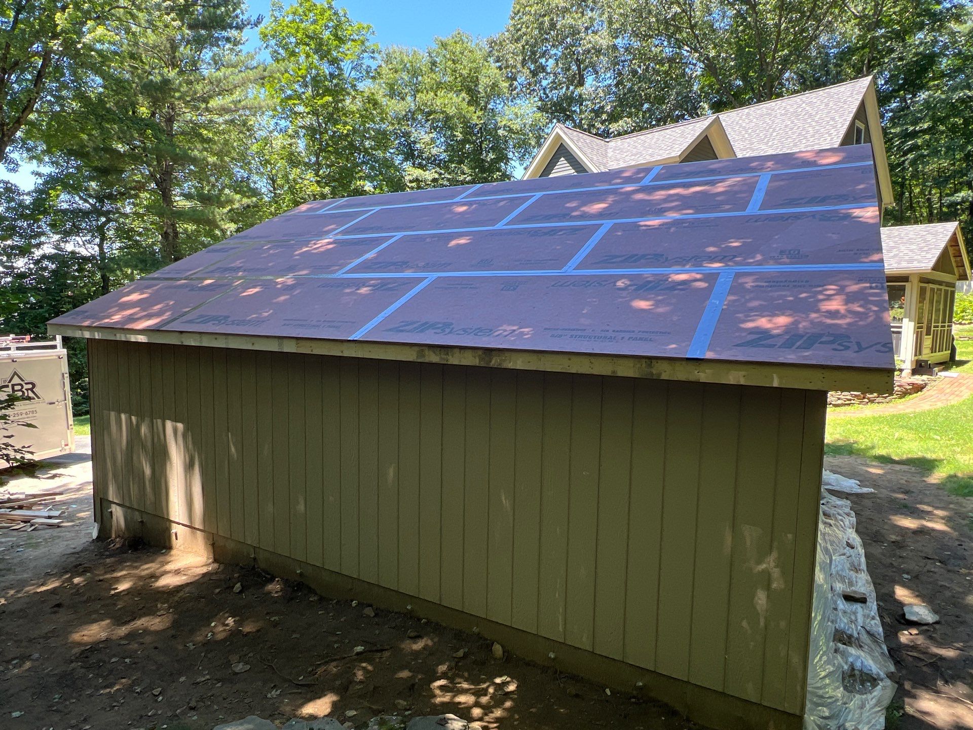 Garage using LP SmartSide Panel Siding by Chagnon Building & Remodeling LLC