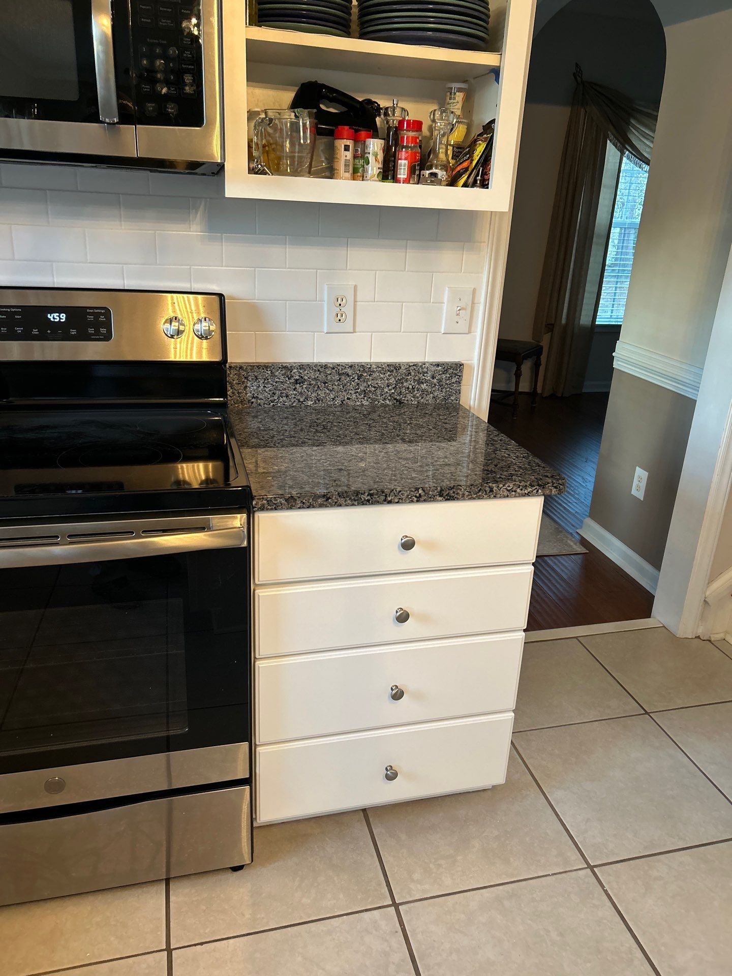 Cabinet painting by GonzalezPainters & Contractors Inc 