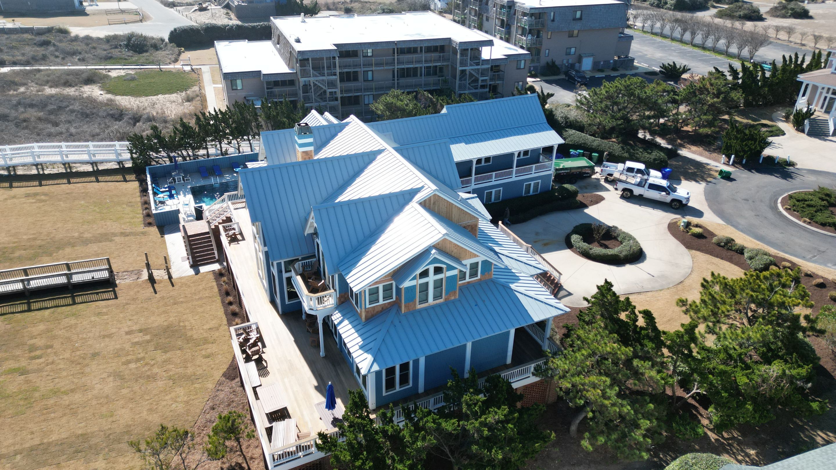 Large Metal Roof Transformation by Gallop Roofing & Remodeling, Inc.