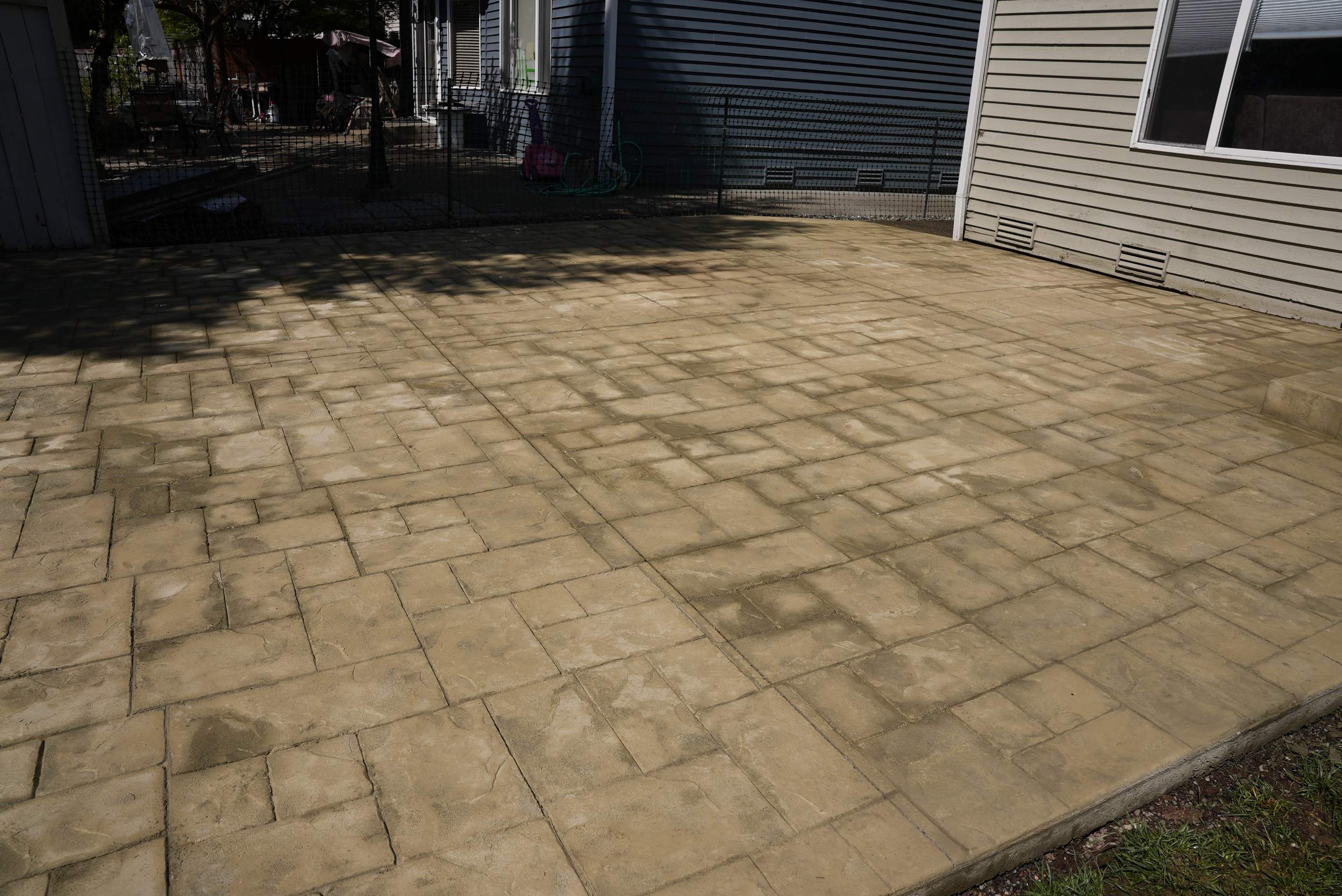 Benedict | Stamped Concrete Back Patio by Jireh Asphalt & Concrete Inc 