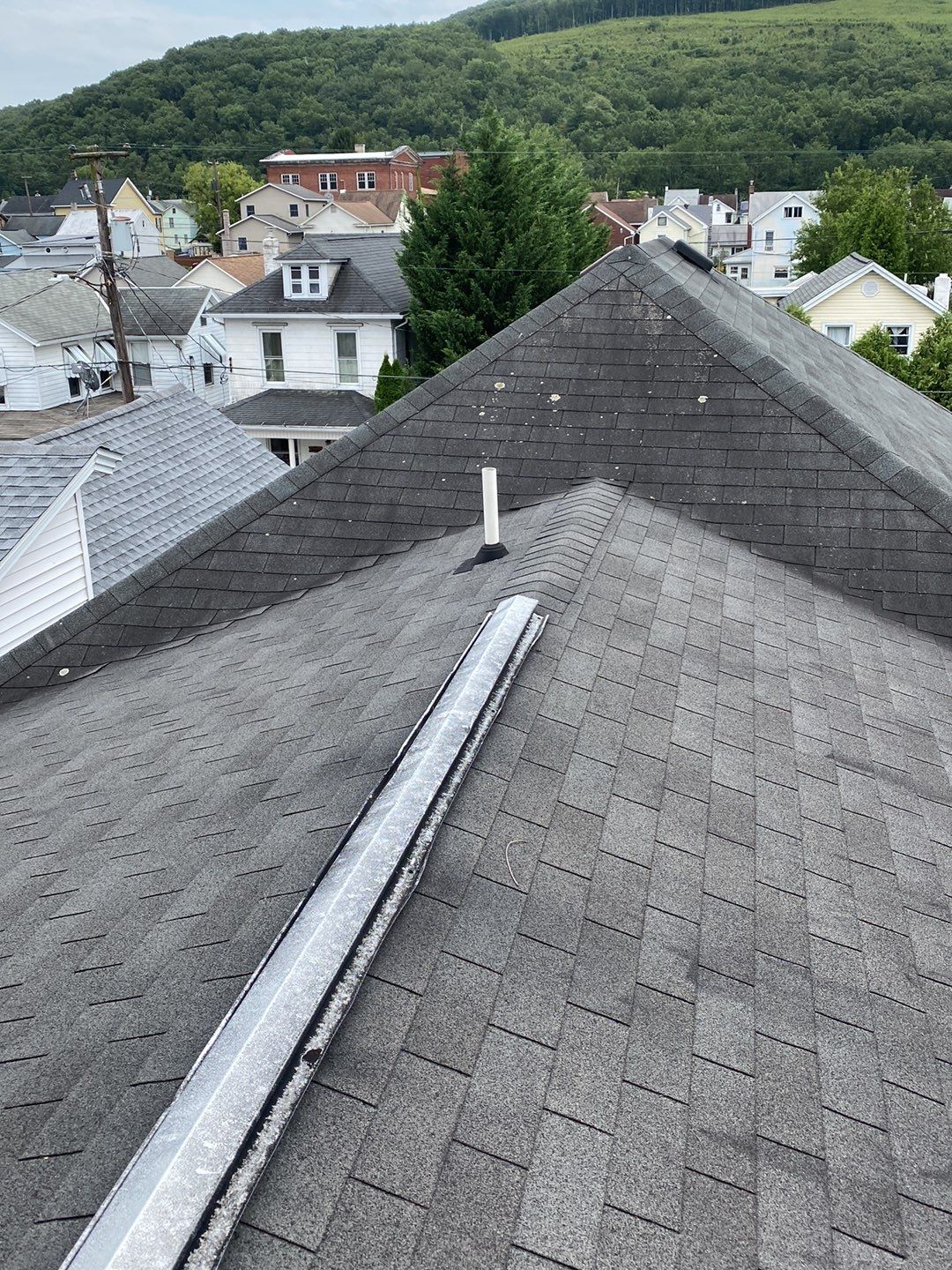 Charcoal Metal Roof & Blue Siding — A Refreshing New Look by Esh Builders