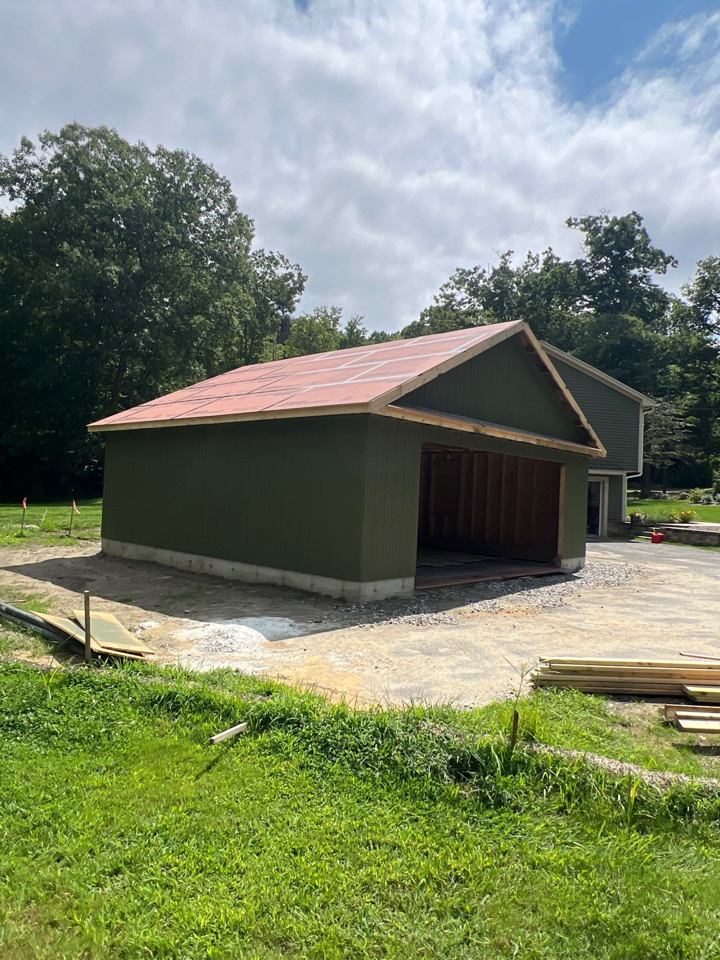 Two-Car Garage using LP SmartSide Panel Siding by Chagnon Building & Remodeling LLC