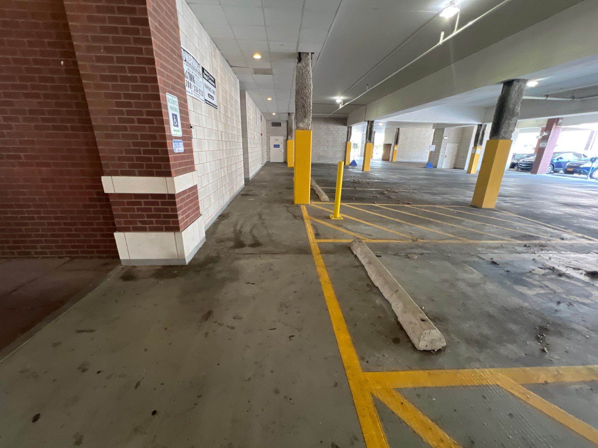 Parking garage using Hot water by Northern Power Washing LLC.