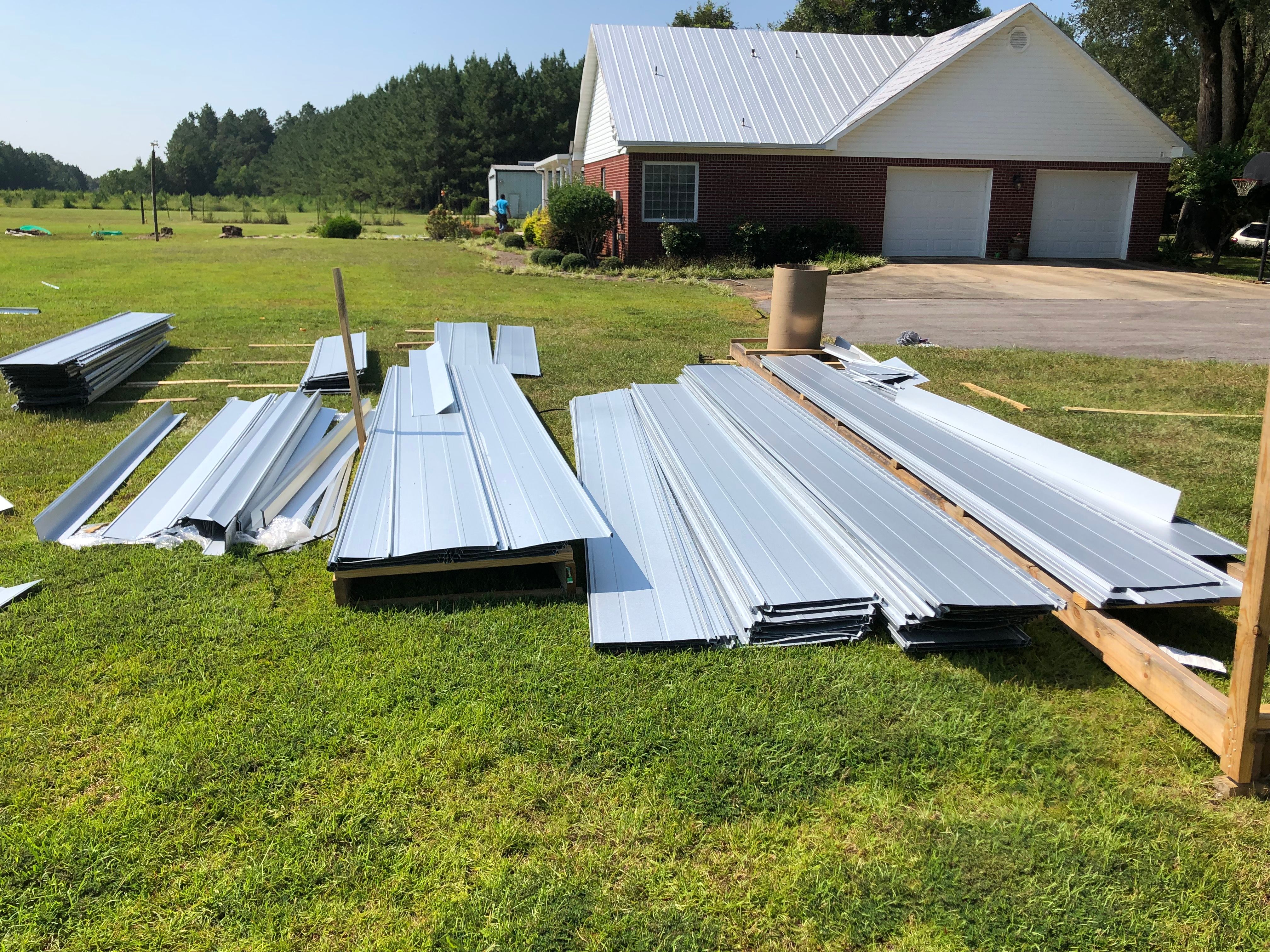 Residential Roofing Installation using Metal roofing by American Roofing & Construction LLC
