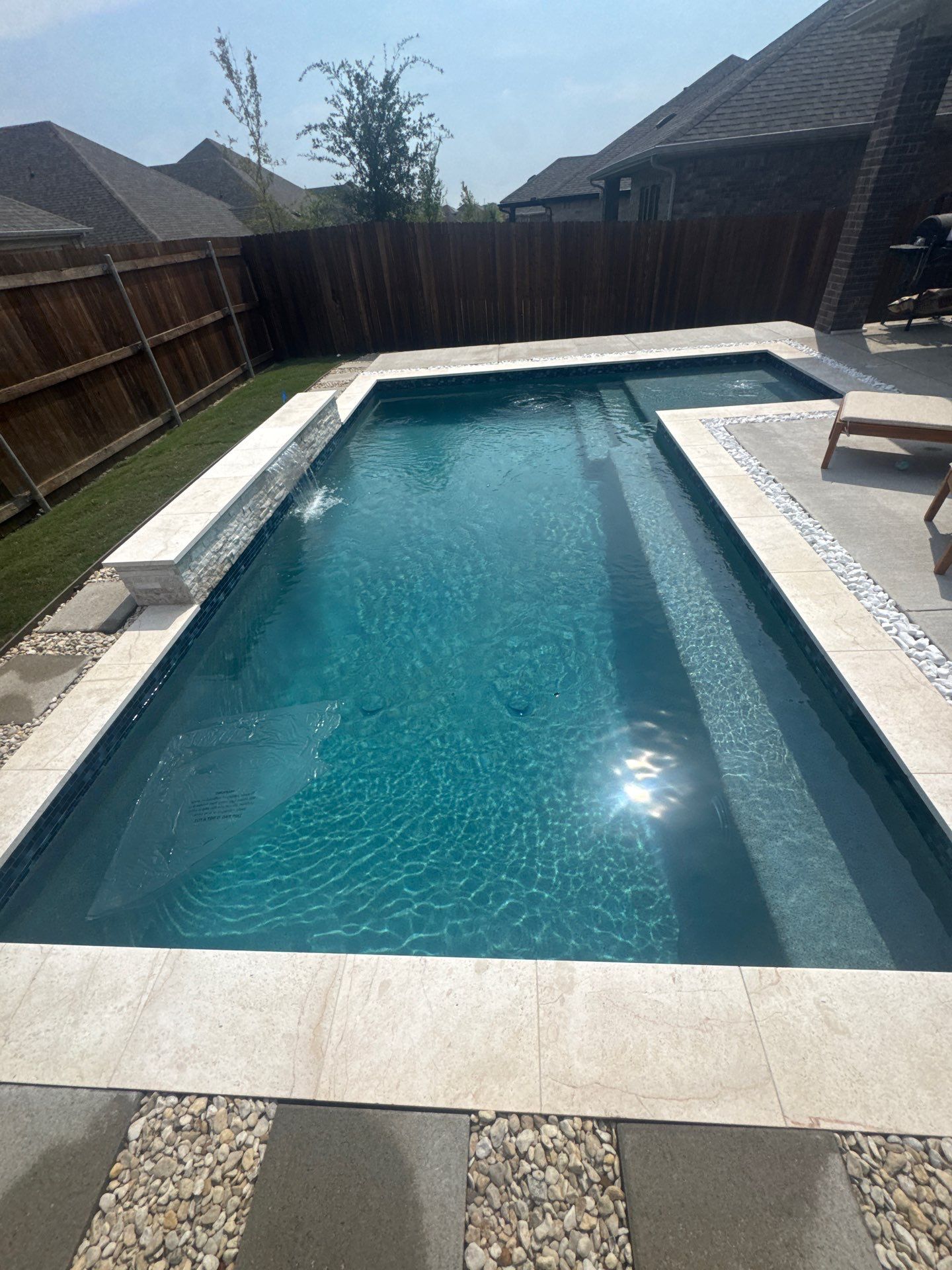 Sleek Geometric Pool with Tanning Ledge and Turf by Pinnacle Pools and Spas - DFW