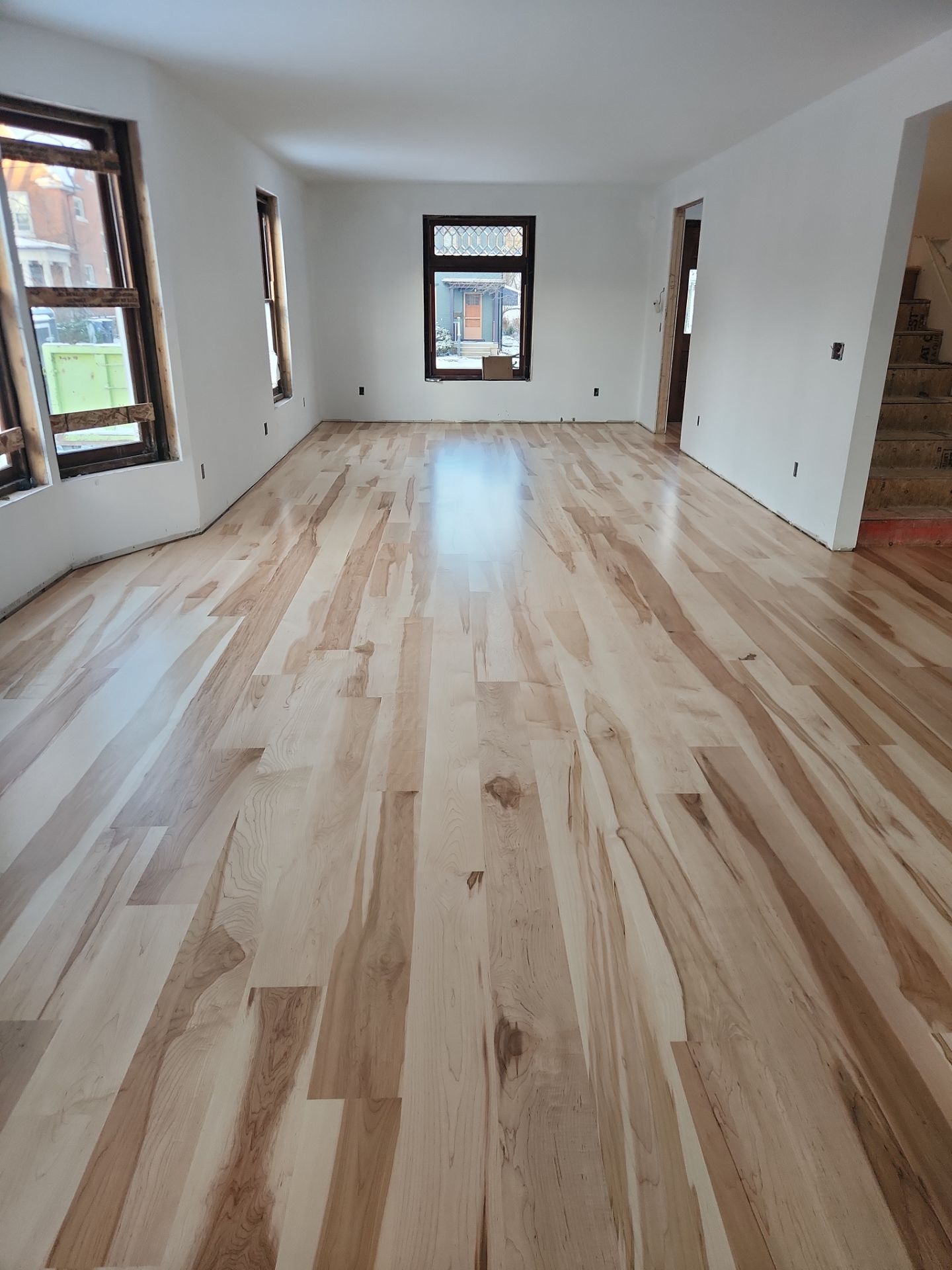 Full glue down Installation over radiant heat 7" Maple character grade by Ann Arbor Hardwoods 