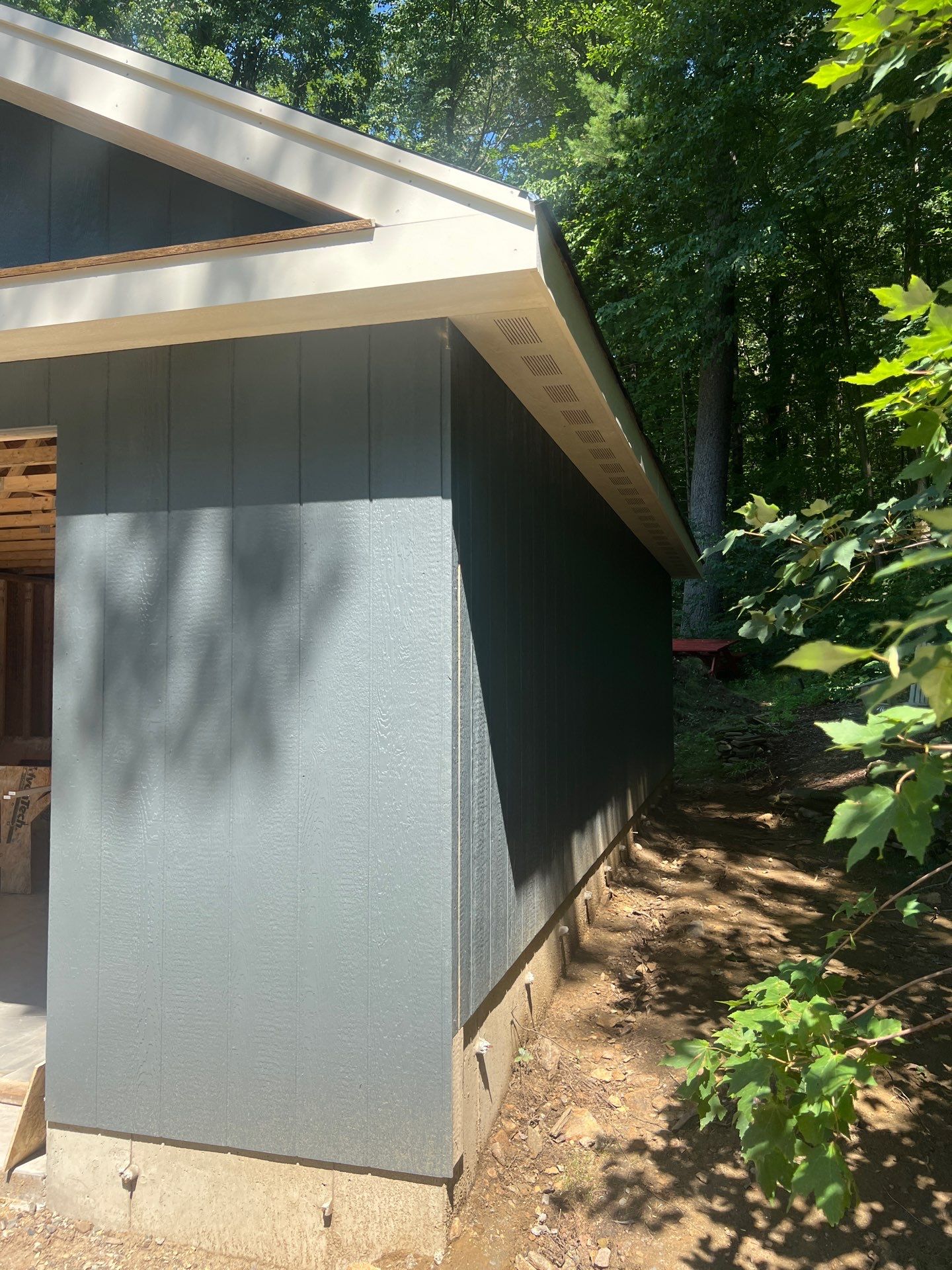 Garage using LP SmartSide Panel Siding by Chagnon Building & Remodeling LLC