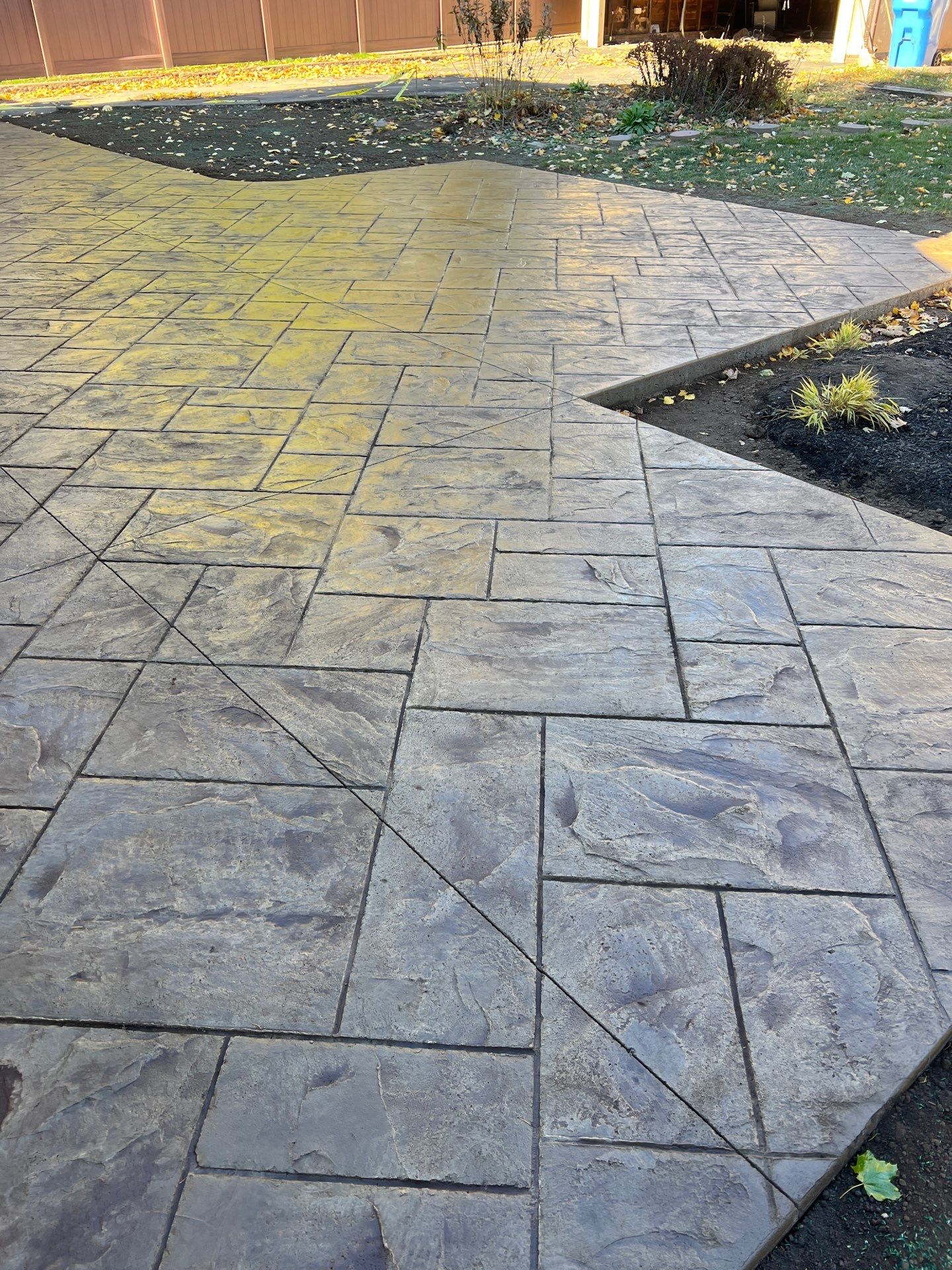Majestic Ashlar stamped concrete patio  by NG Masonry & Construction LLC