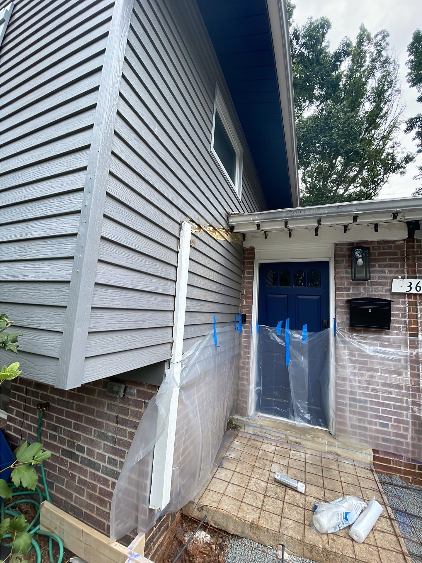 New walkway with stairs and a new front porch by Fairfax Contractors, LLC