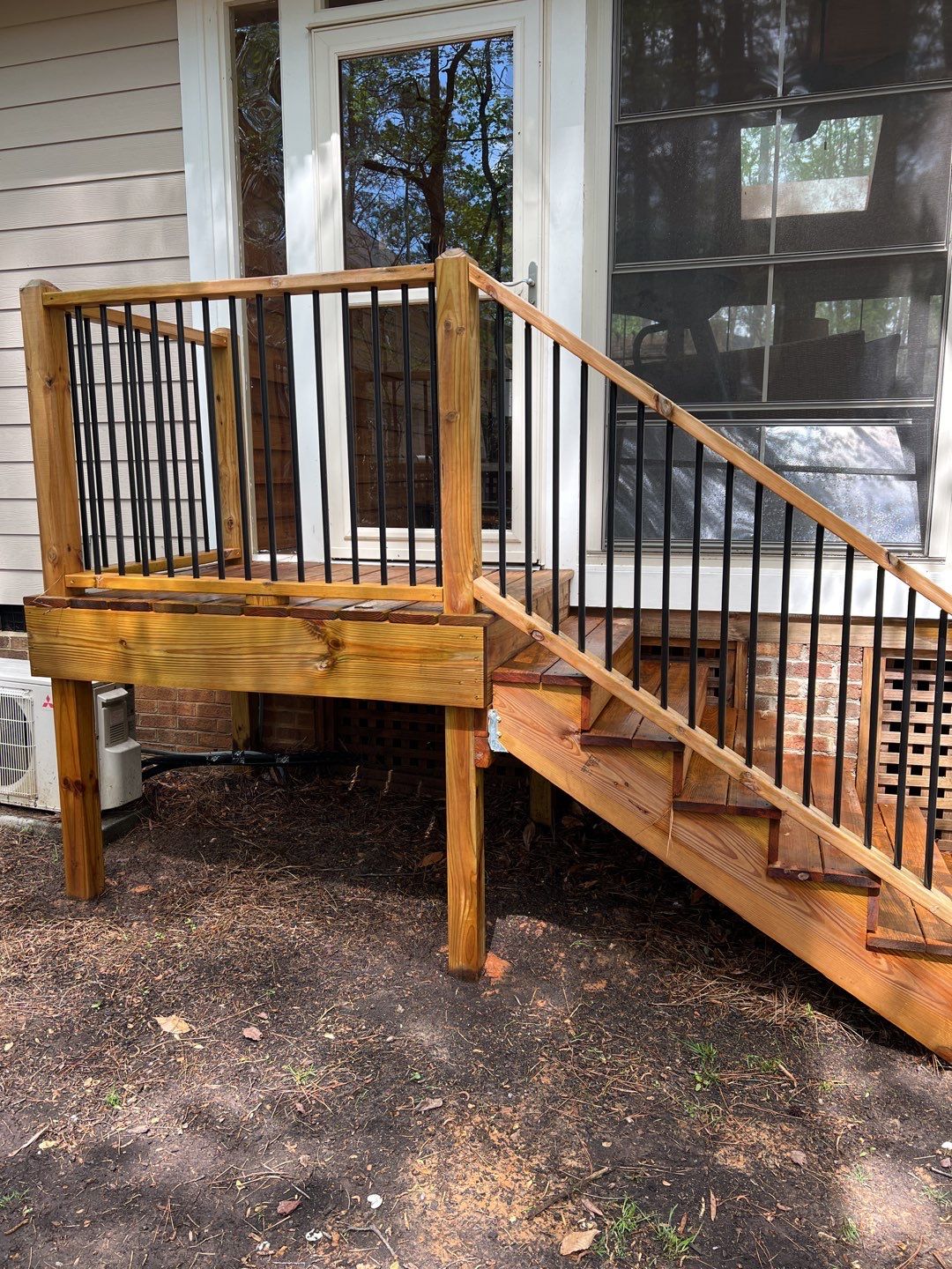 Deck and Stamped Concrete Patio by DuraSeal