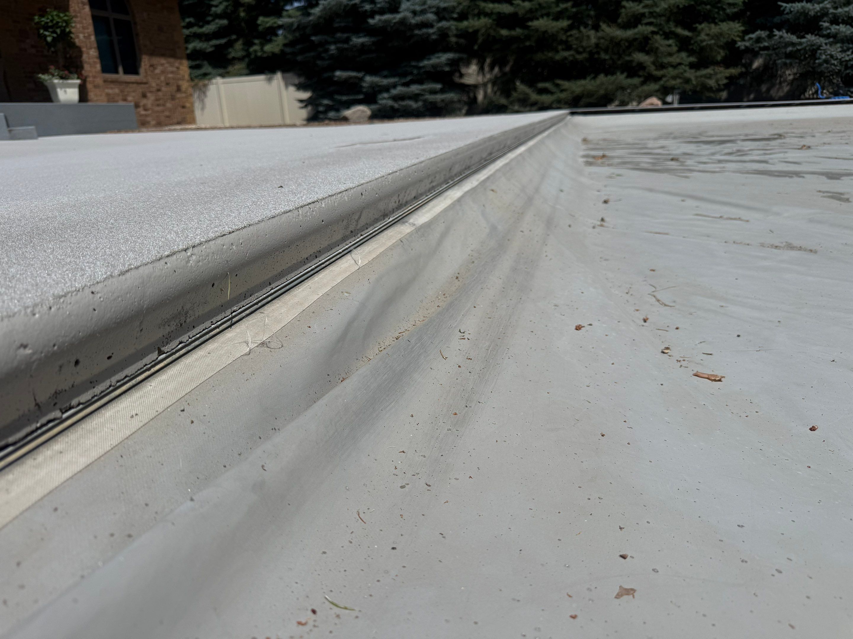 Decorative Concrete Pool Deck and Patio Resurfacing in Sioux Falls by Select Painting, Coatings & Garage Cabinets