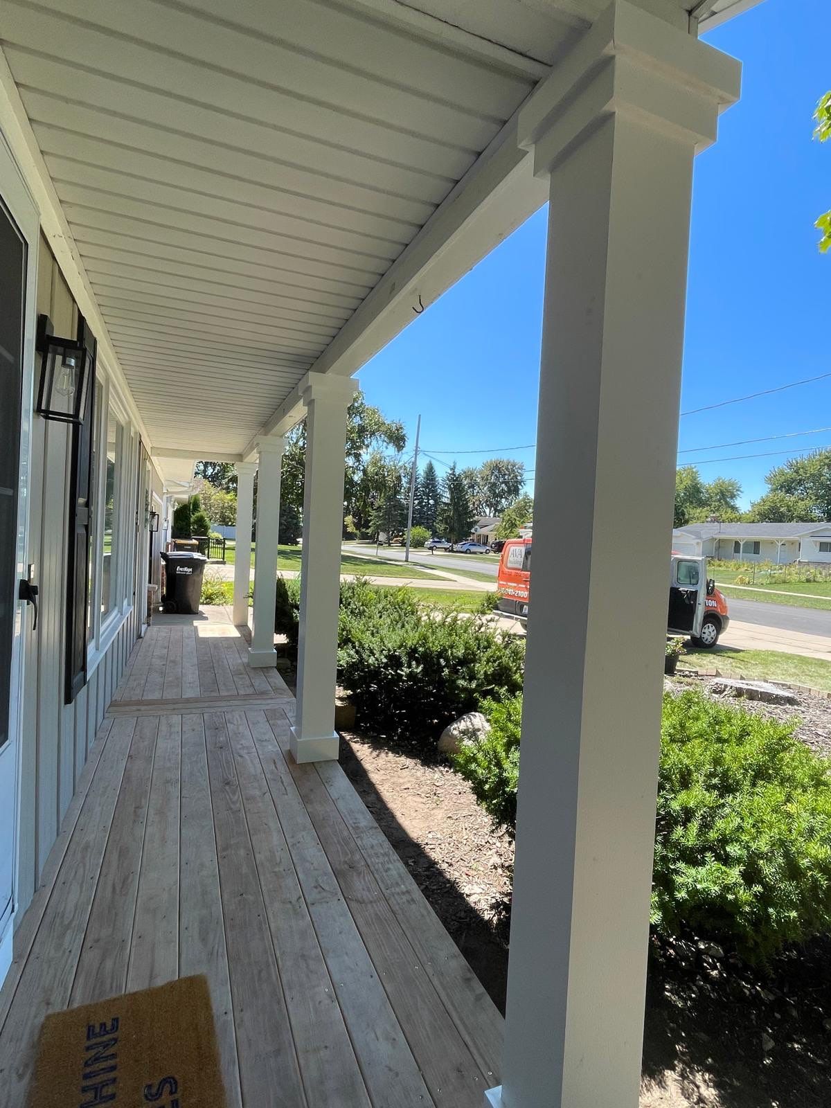 Front Porch Posts and Treated Porch Floor and Steps by Avalon Roofing and Exteriors