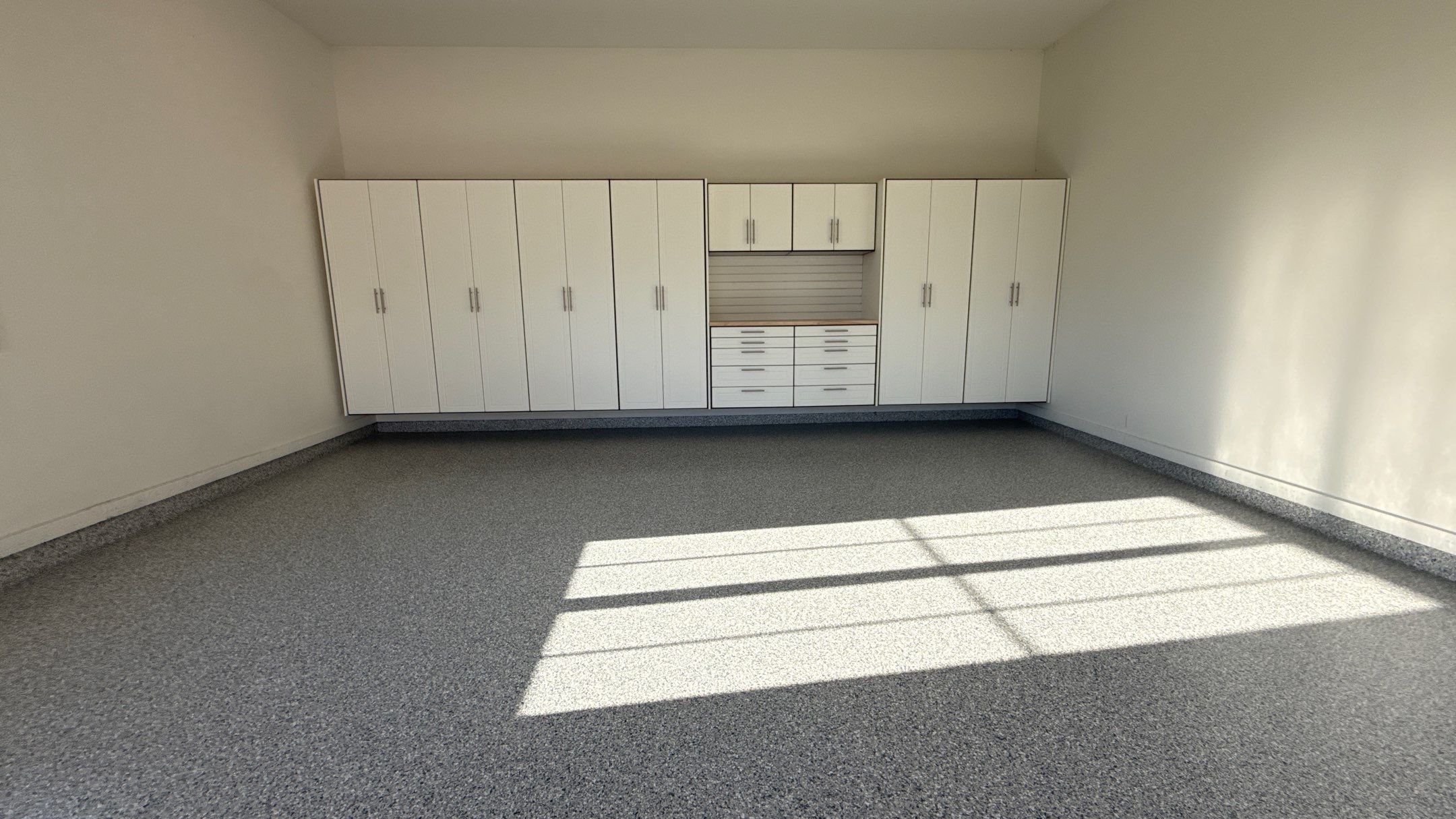Garage Remodel with Custom Cabinets and Epoxy Floors in Overland Park by Banner Garage