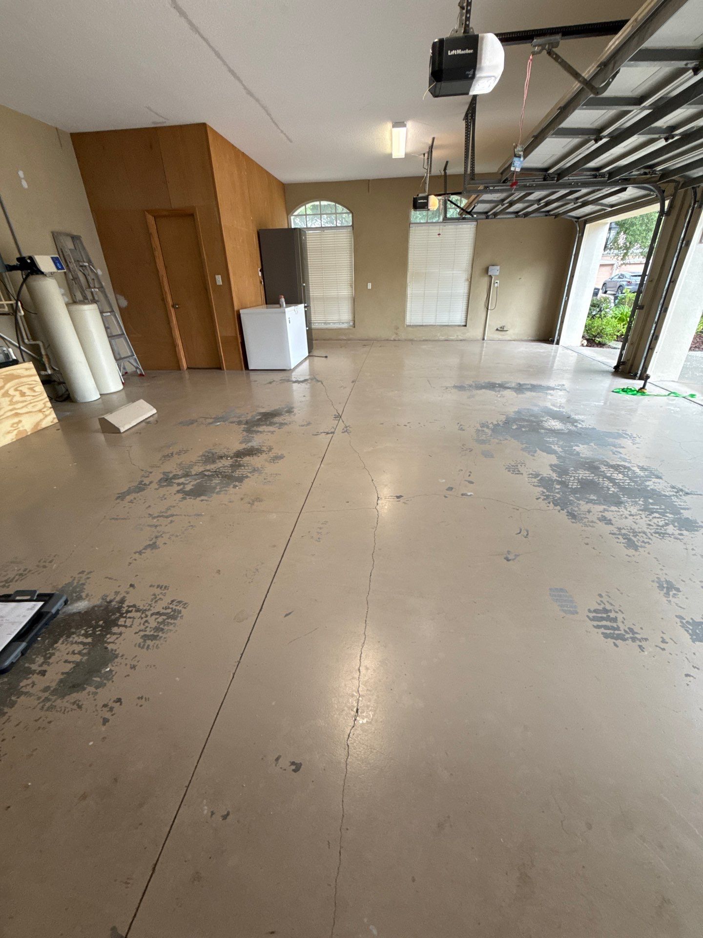 Tampa Garage Floor Coating and Overhead Storage Rack Installation by Square 1 Garage and Closet Solutions