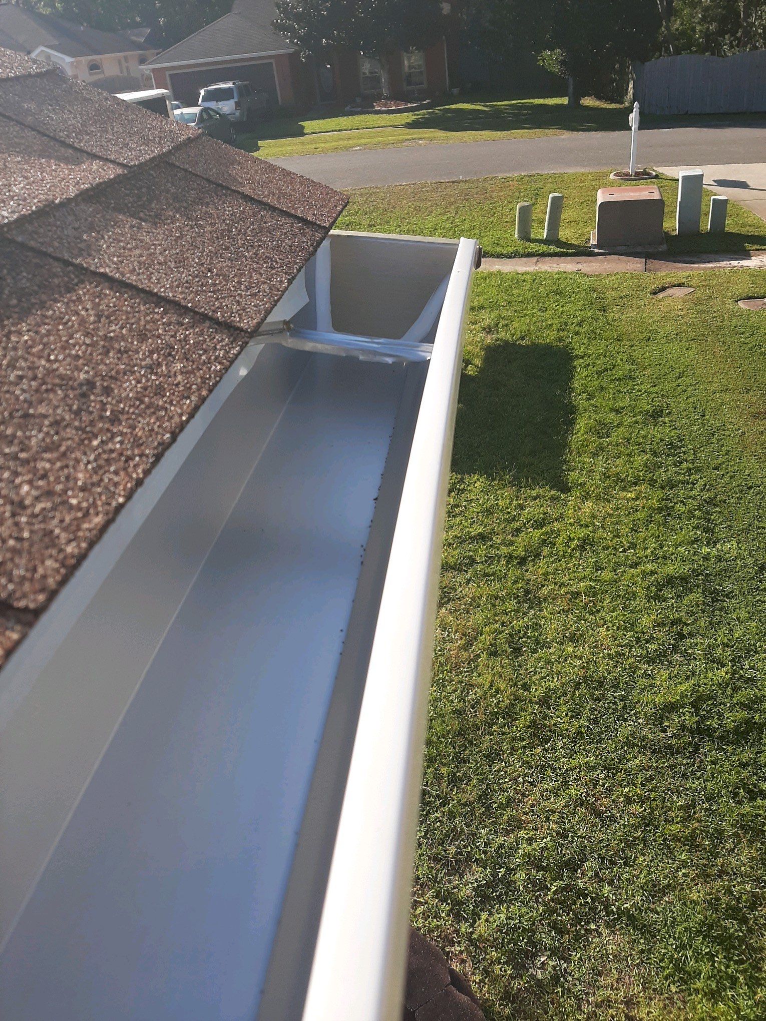 Seamless Gutter Installation using White K-Style Gutters by Gutter Professors