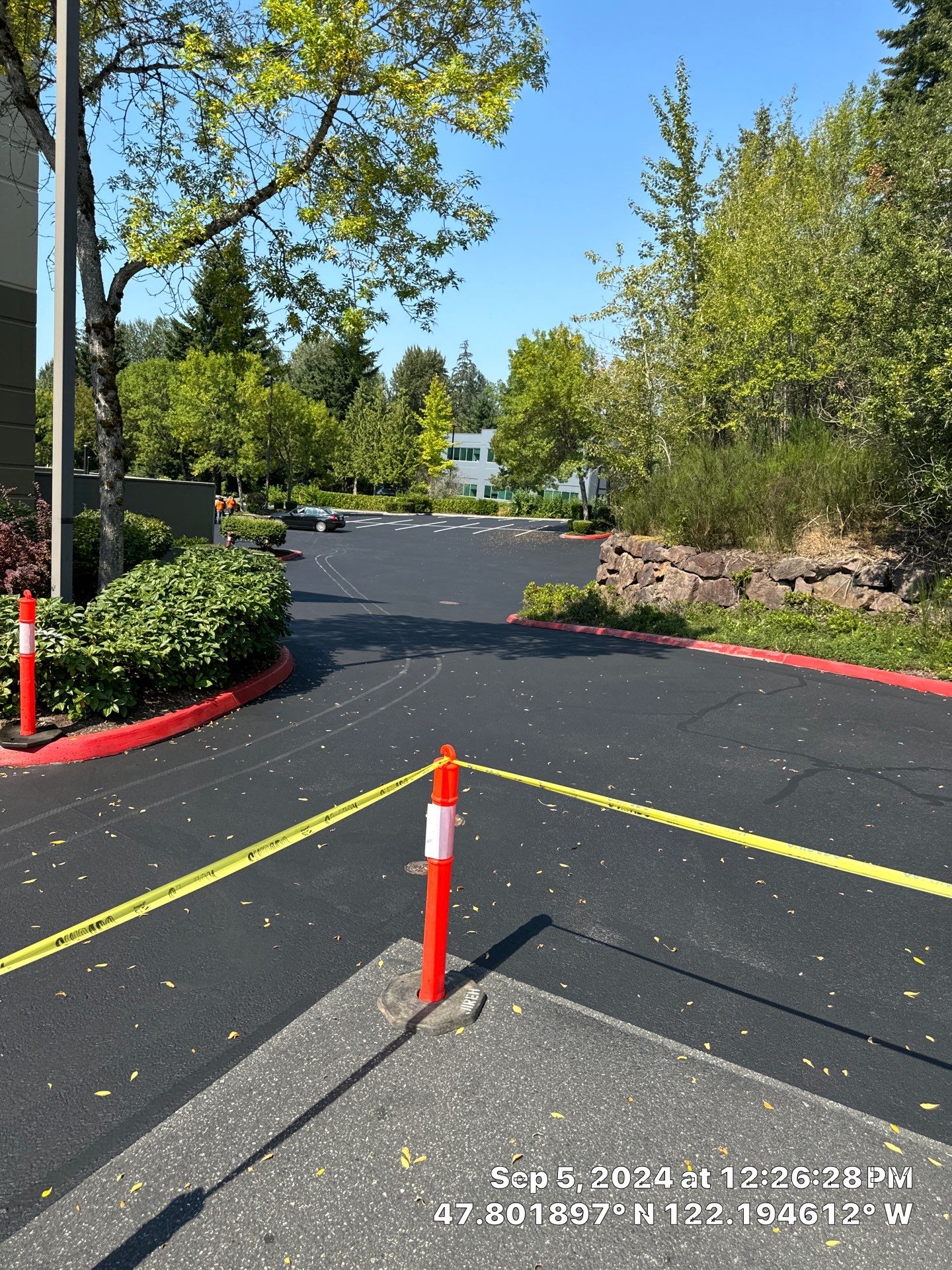 Kidder Matthews | Parking Lot Sealcoating & Striping with Concrete Curb & Patch Repairs  by Jireh Asphalt & Concrete Inc 