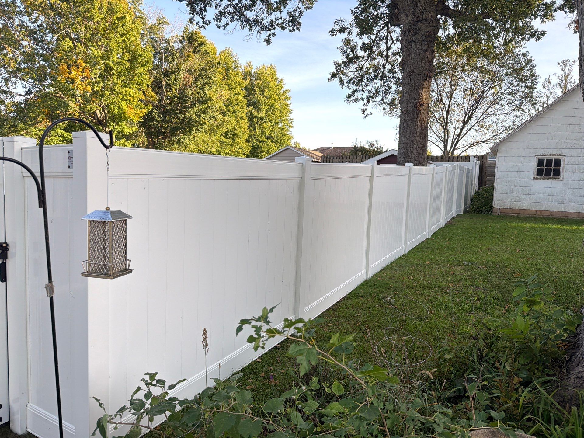 White Vinyl Privacy Fence and Gate Installation in Grundy Center by Perfect Picket Fence and Stain