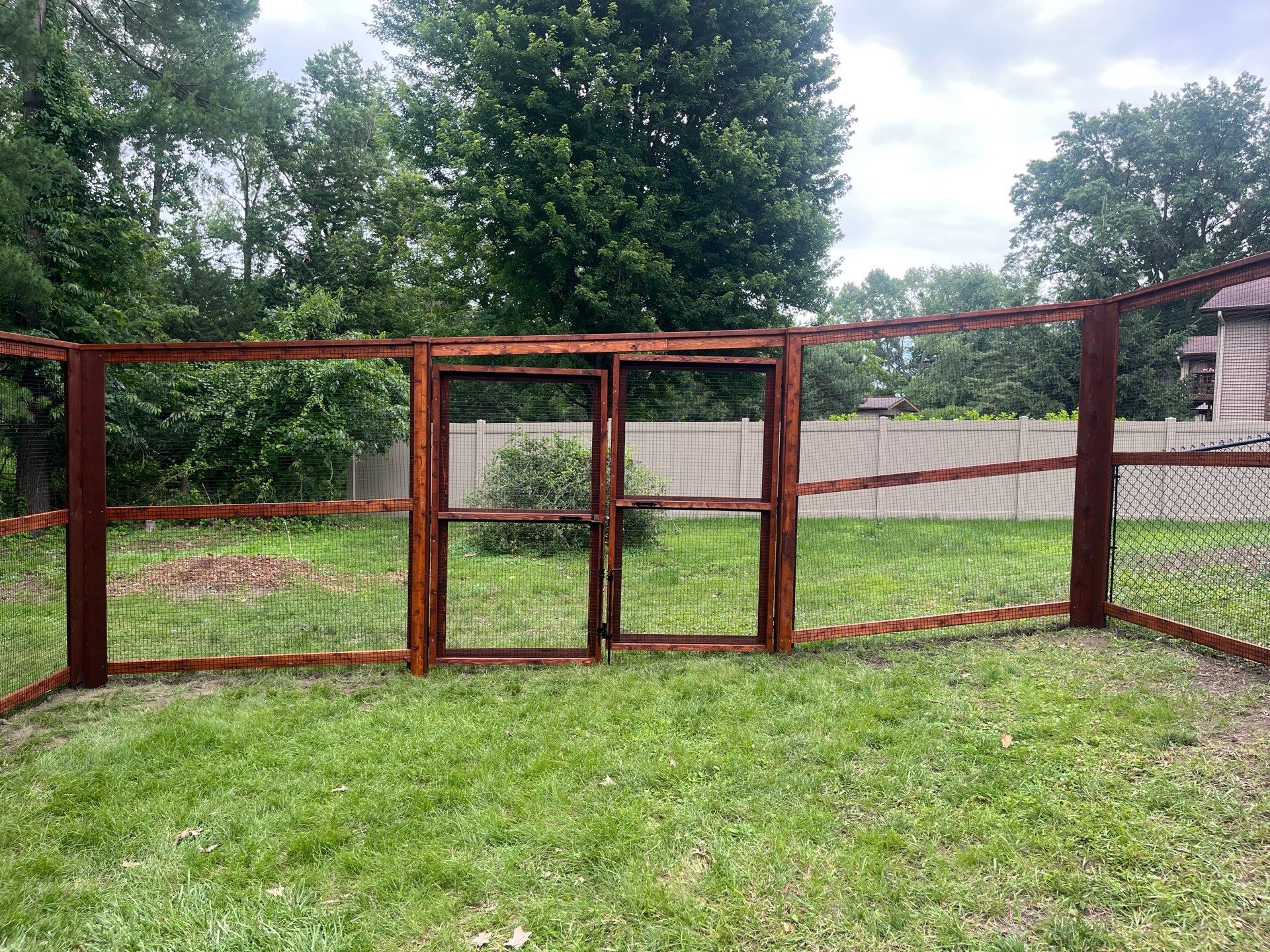 Stained Cedar Mahogany Garden Fence and Raised Bed Enclosure in Cedar Falls by Perfect Picket Fence and Stain