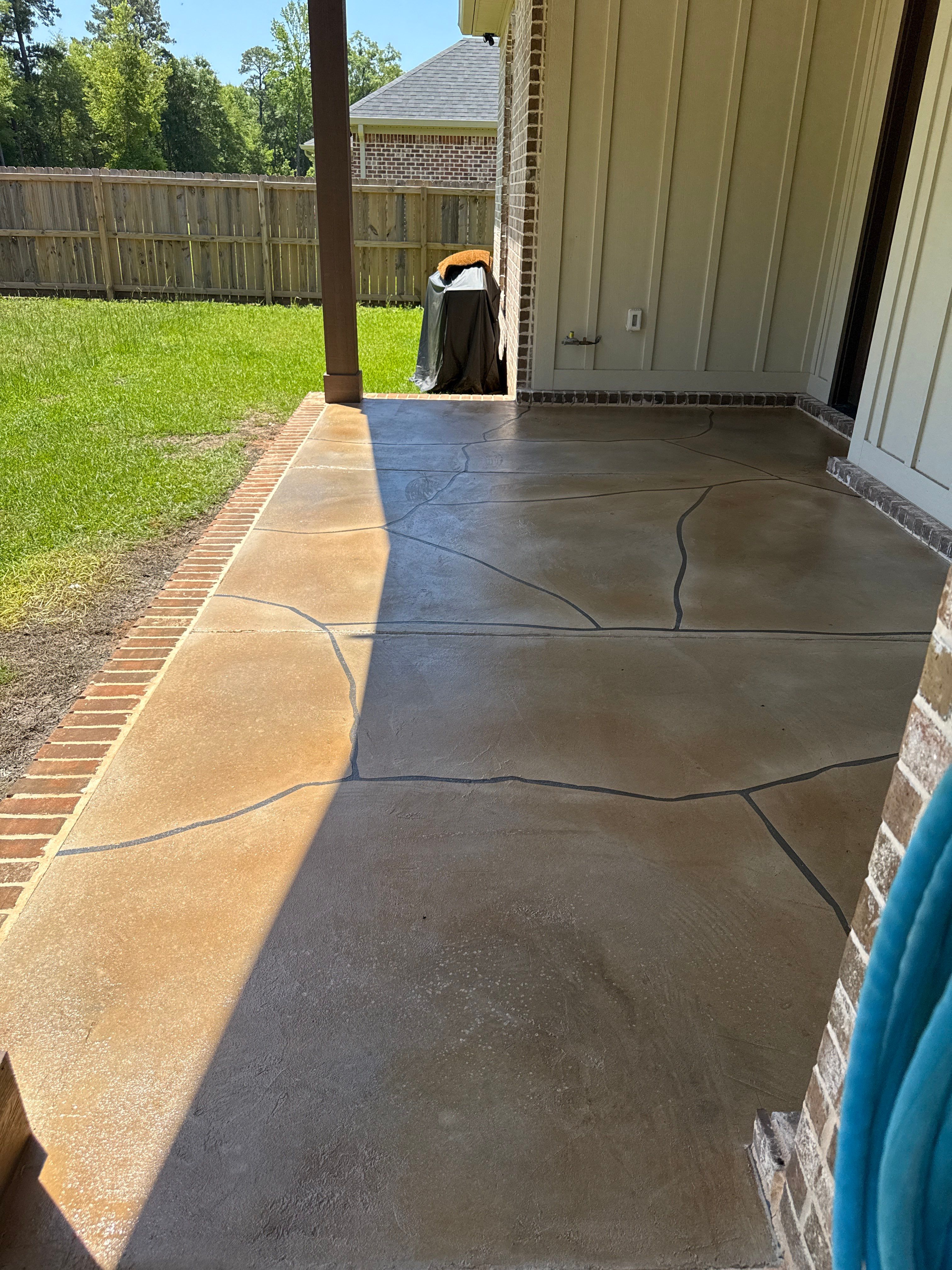 Decorative Stained Concrete Overlay and Garage Floor Coating in Mobile by Cornerstone Hard Surface Restoration 