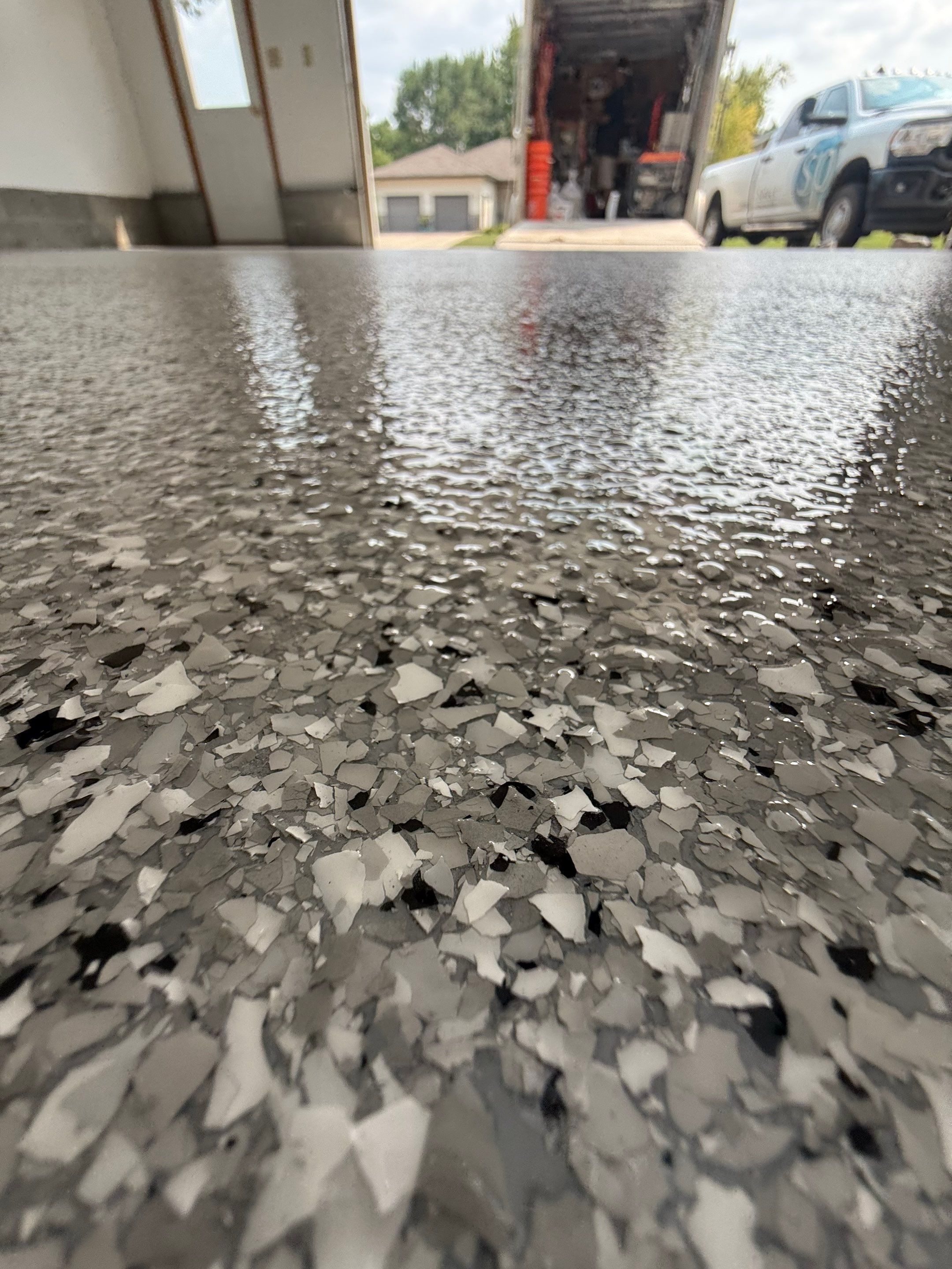 Feather Grey Garage Floor Coating and Concrete Restoration in Mitchell by Select Painting, Coatings & Garage Cabinets