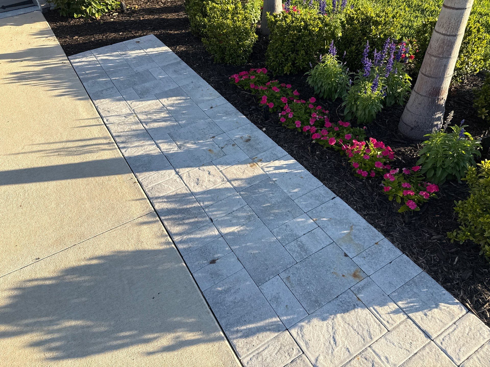 Rust Stain Removal from Concrete Driveway and Pavers in Park East at Azario | Lakewood Ranch, FL by Sunshine AquaWash