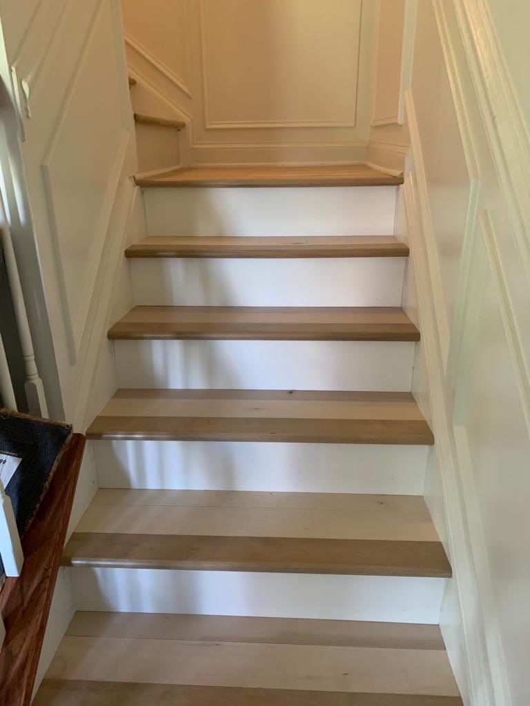 Flooring Installation using Maple Hardwood by Greenspring Construction Services