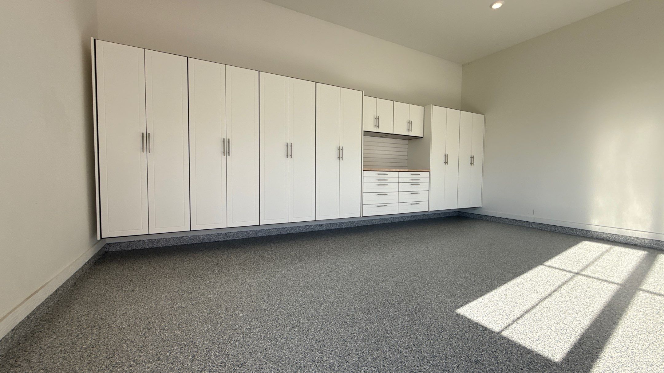 Garage Remodel with Custom Cabinets and Epoxy Floors in Overland Park by Banner Garage