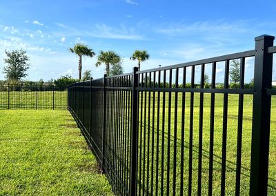 Aluminum Fence Installation using Black 3 Rail Aluminum Fence